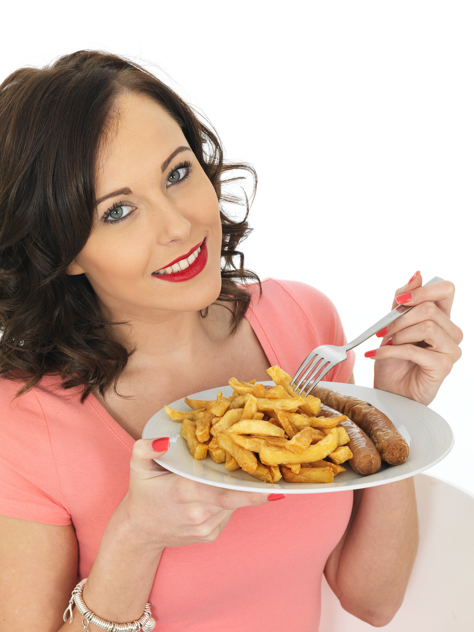young woman enjoying eating jumbo sausage and chips