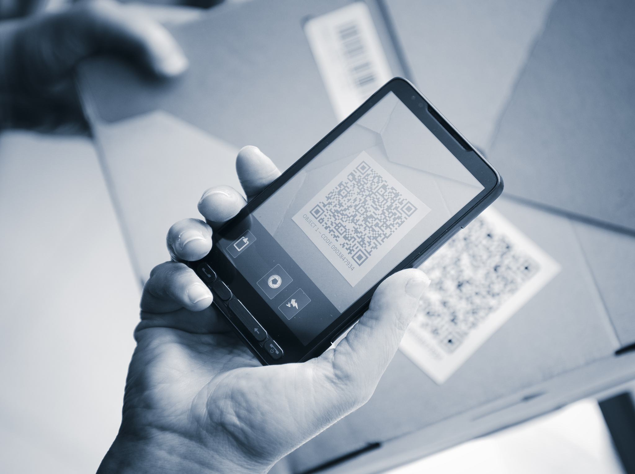holding a smartphone photography qr code
