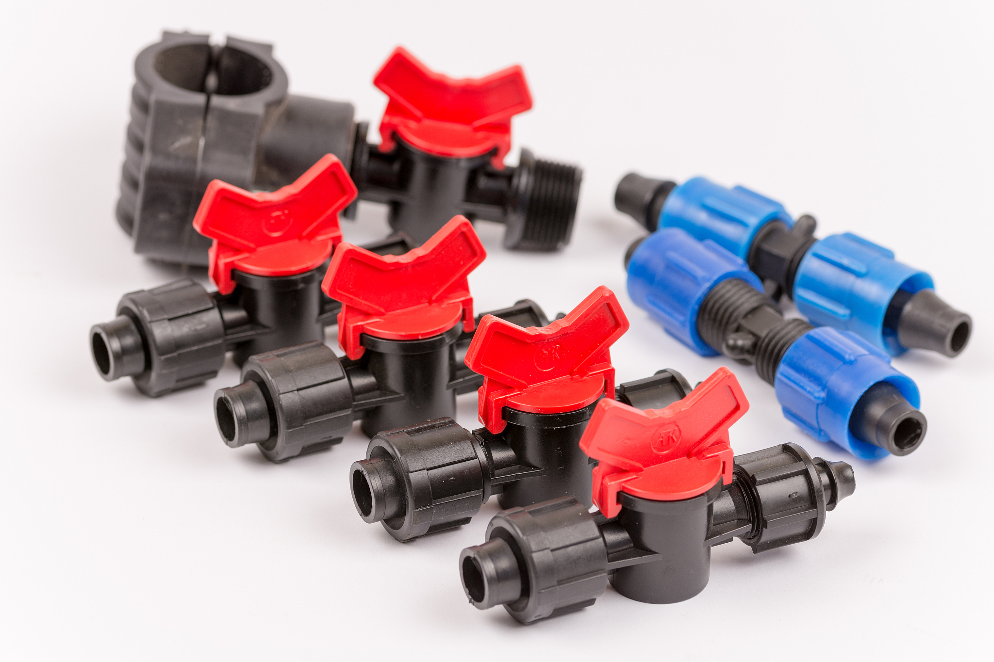 pile of irrigation tools and valves over white