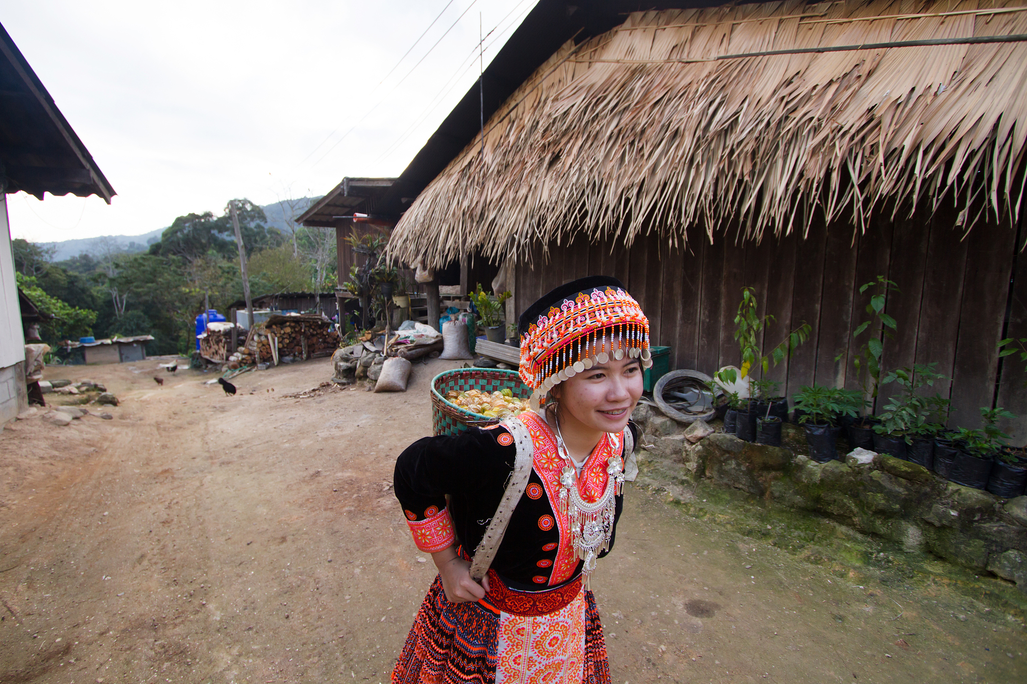 happy hill tribe smiling while walking in the village