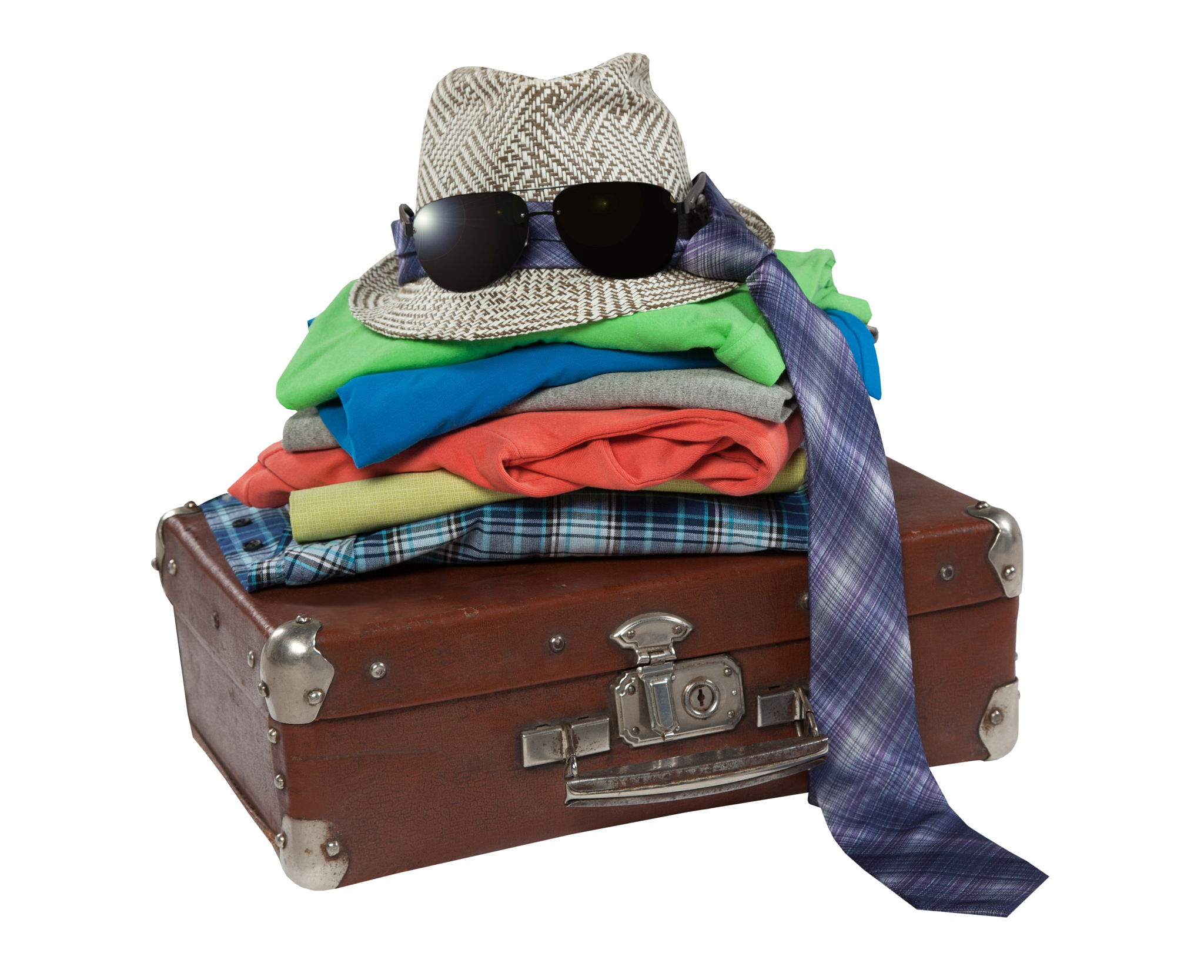 folded things on old suitcase, isolated on white background