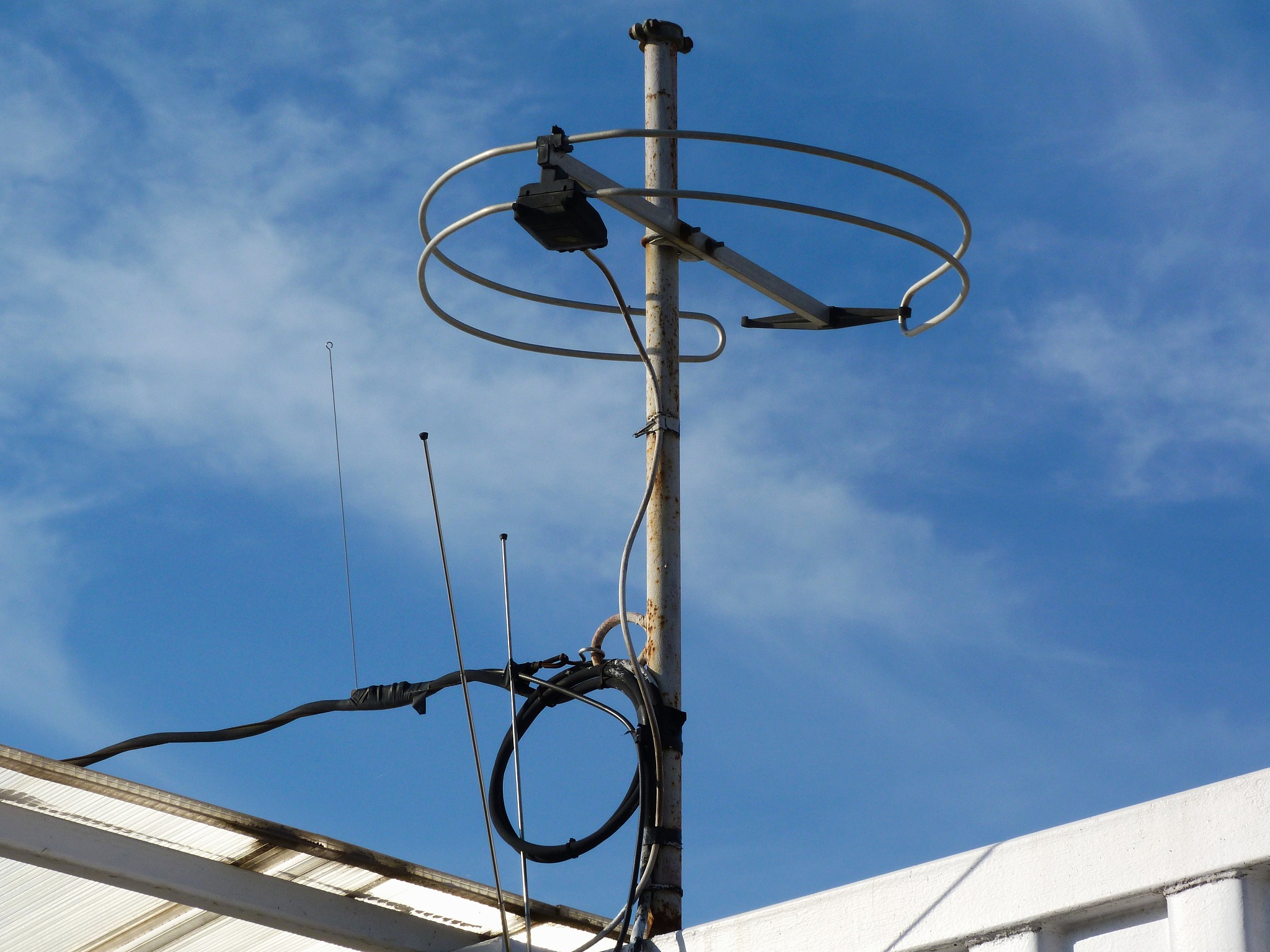 compact white circular telecommunication antenna