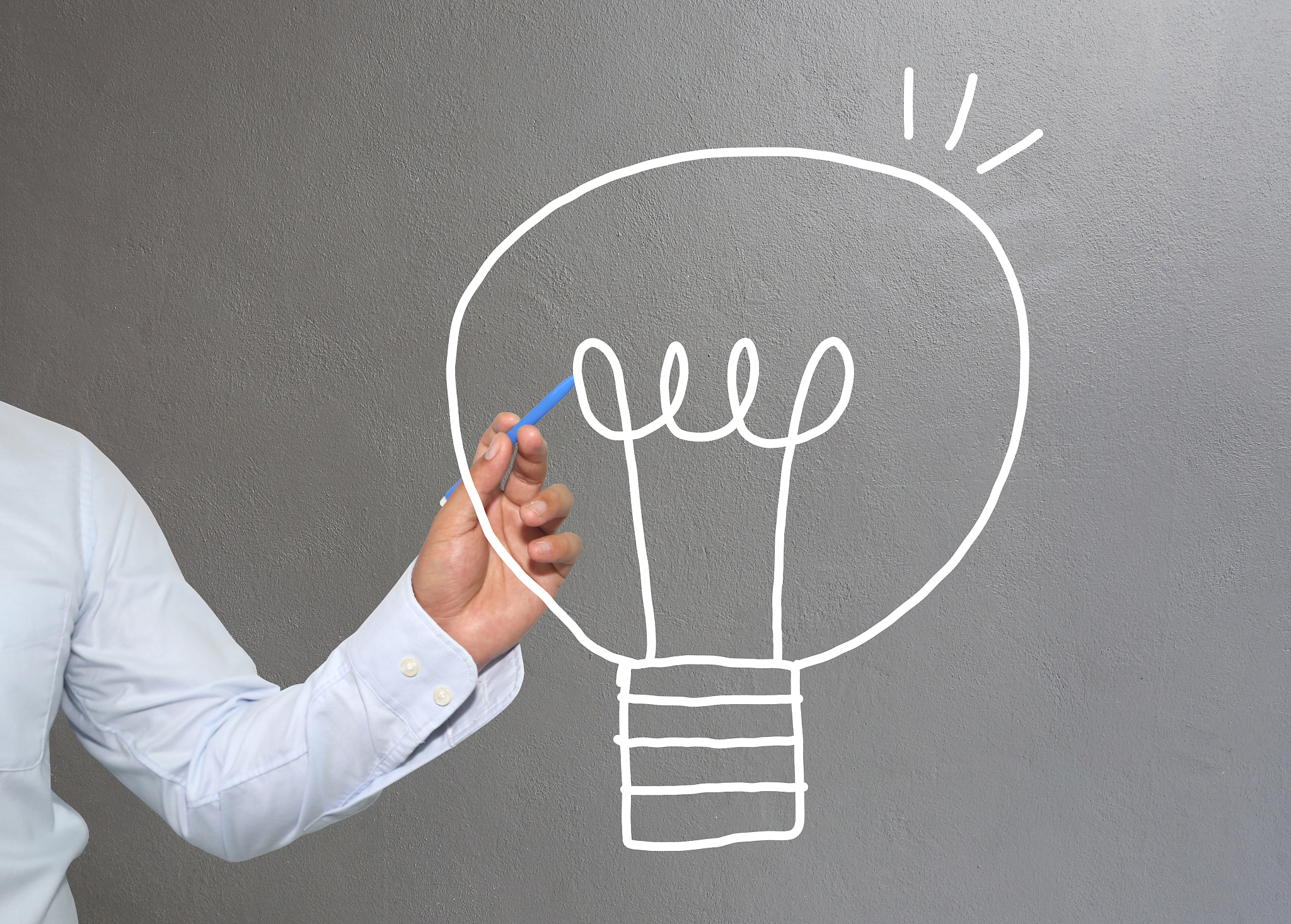 digital composite image of businessman drawing against wall