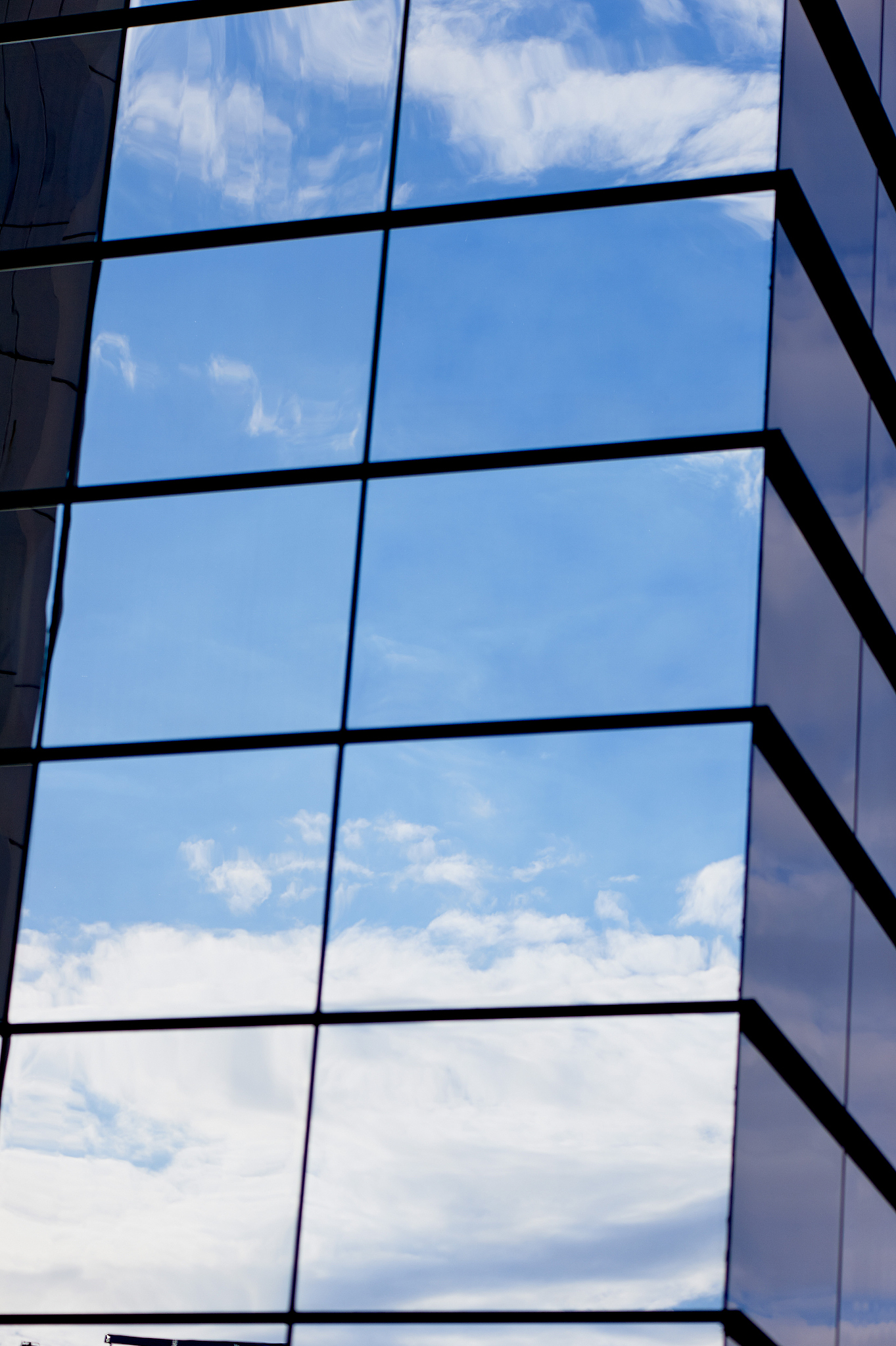 the reflection of the sky mirrored building