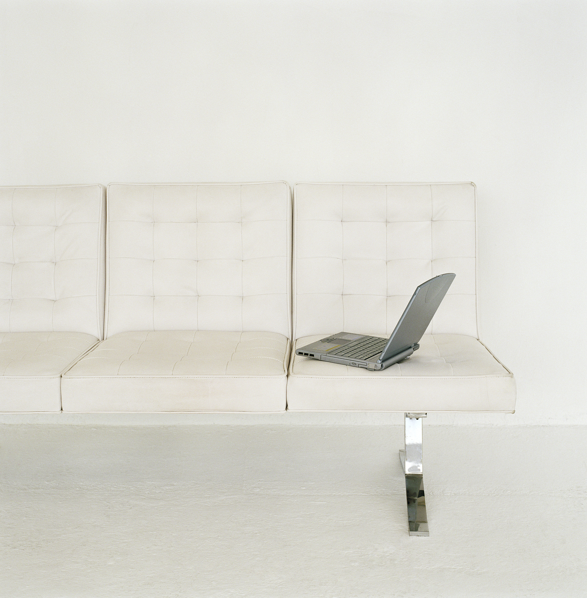 laptop left sitting on sofa