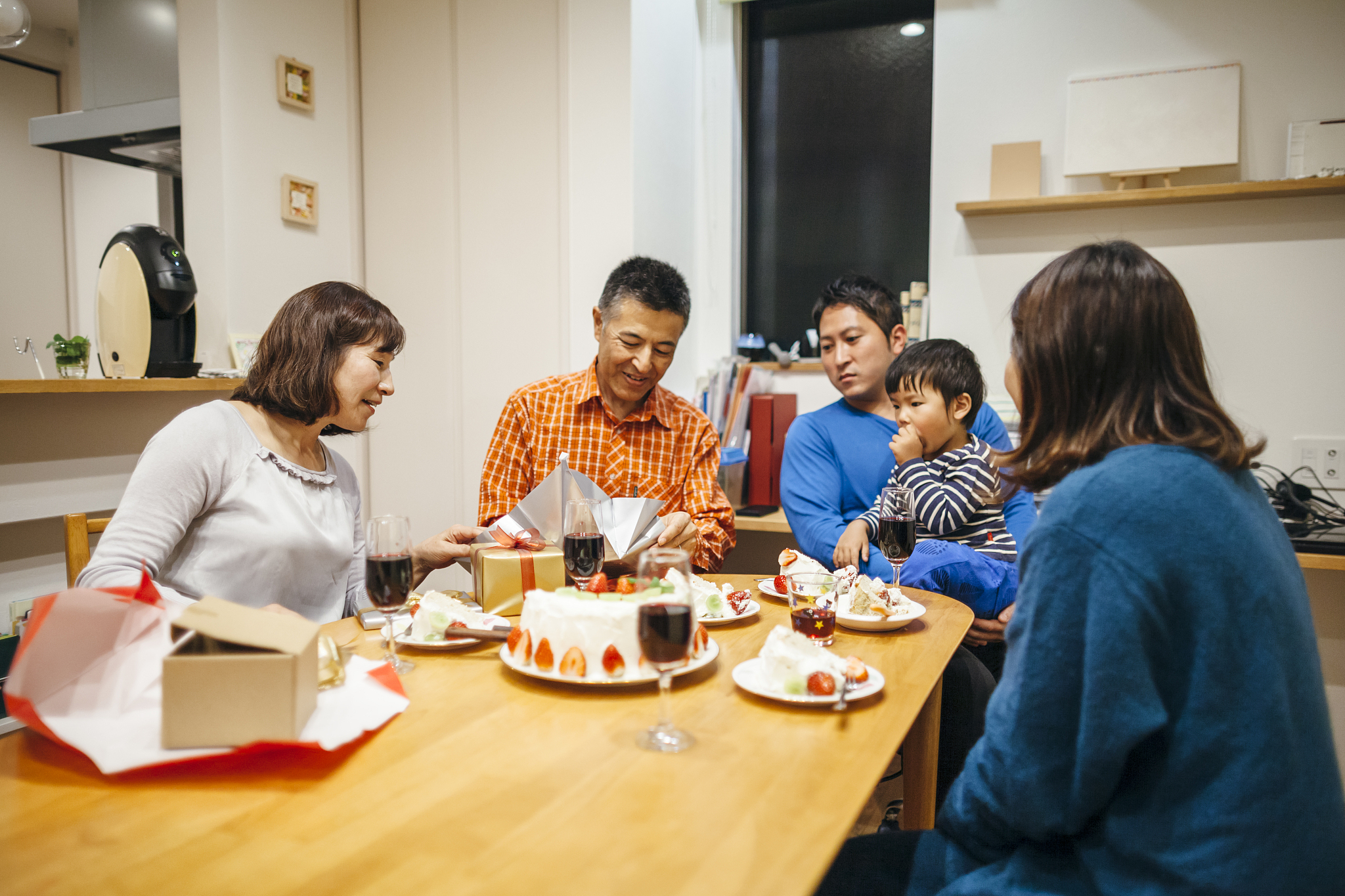 three generation family having birthday party at home