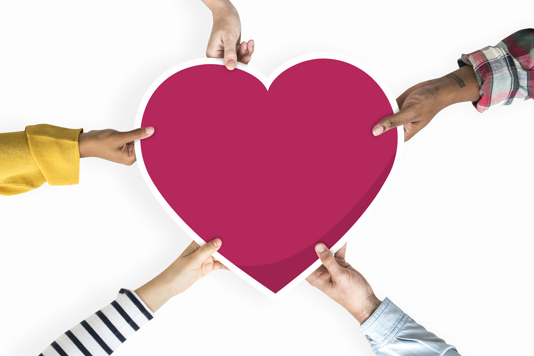 diverse hands holding a red heart