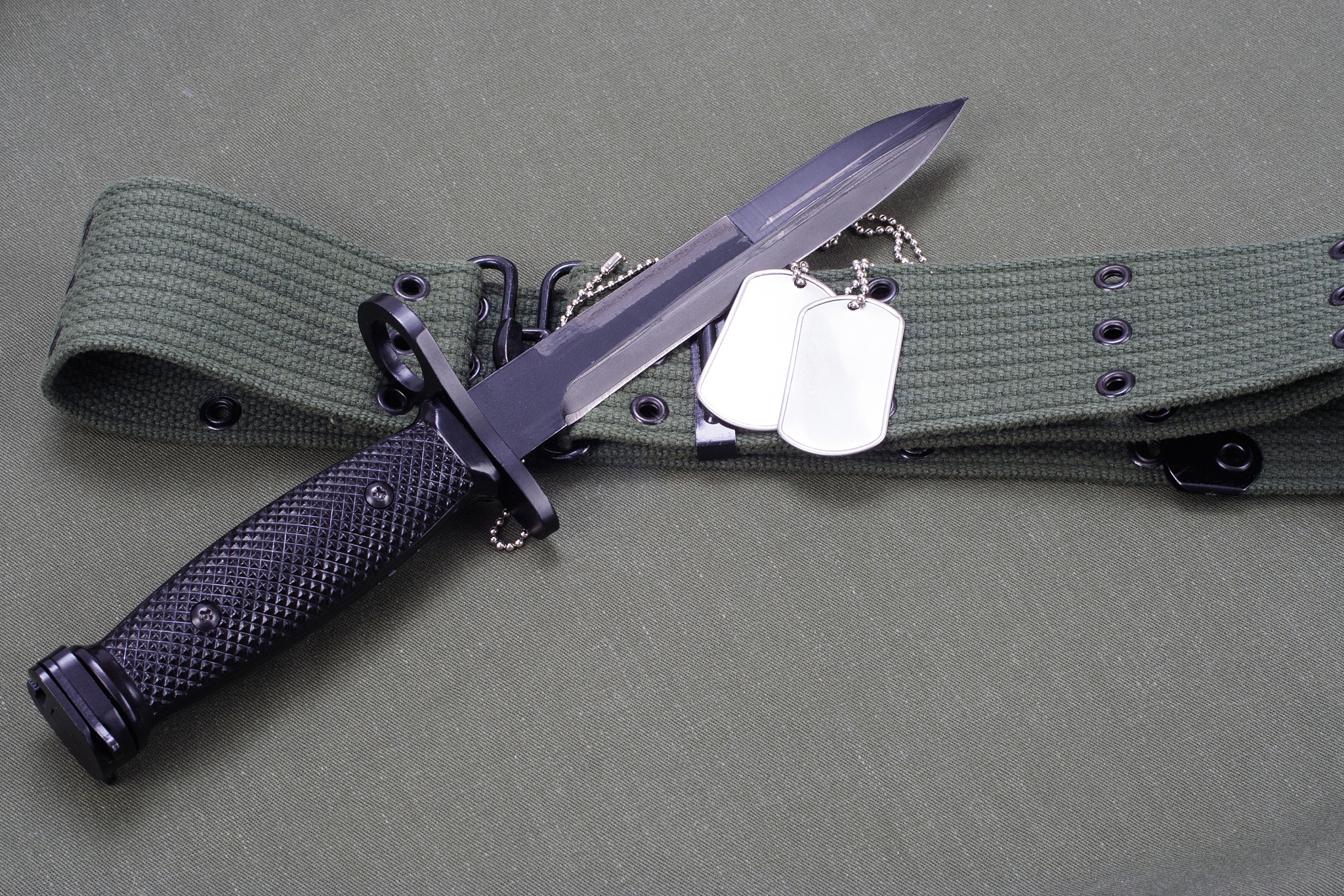 m16 rifle bayonet on uniform background