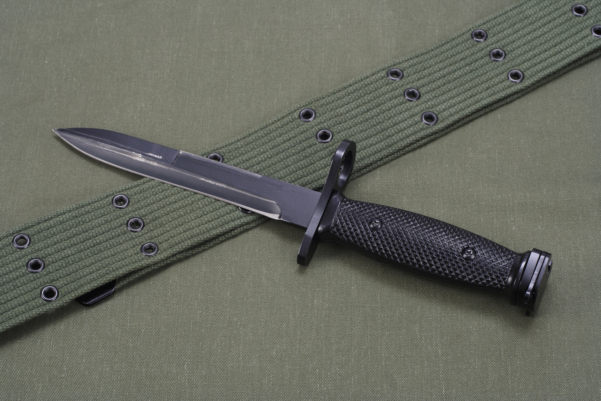 m16 rifle bayonet on uniform background