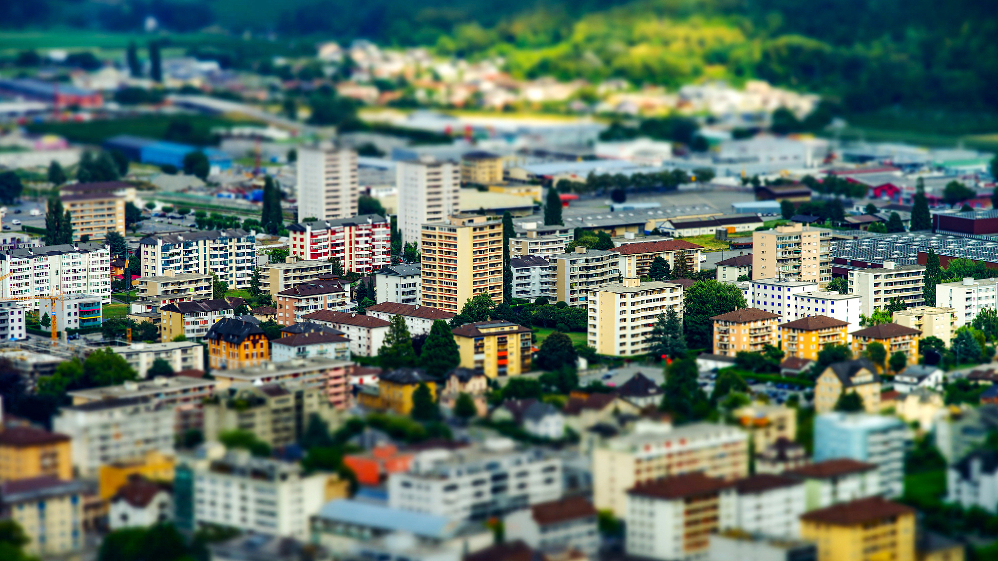 tilt-shift miniature aerial view of new quarter in martigny, swi