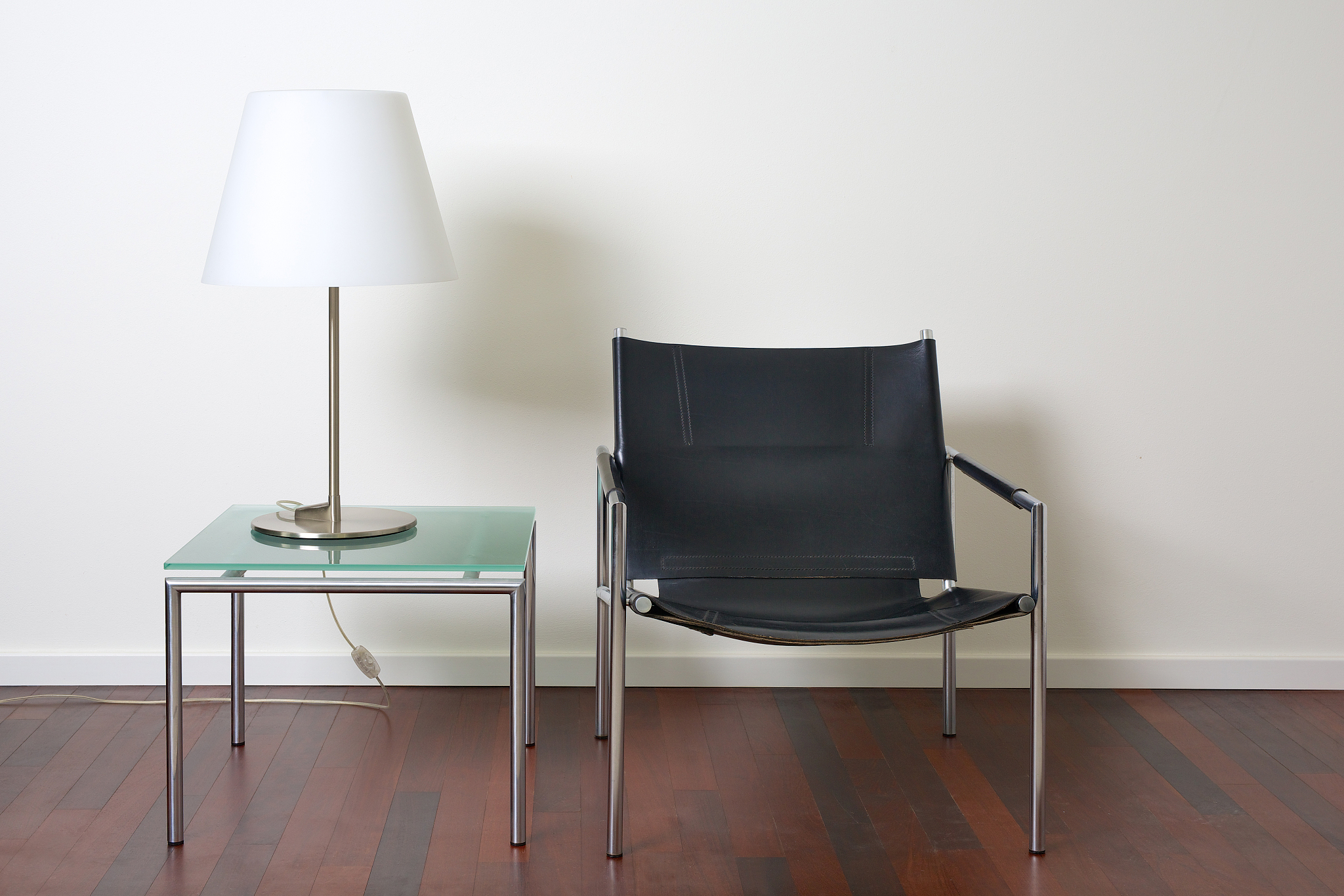 lamp, table and chair in modern interior with white wall.