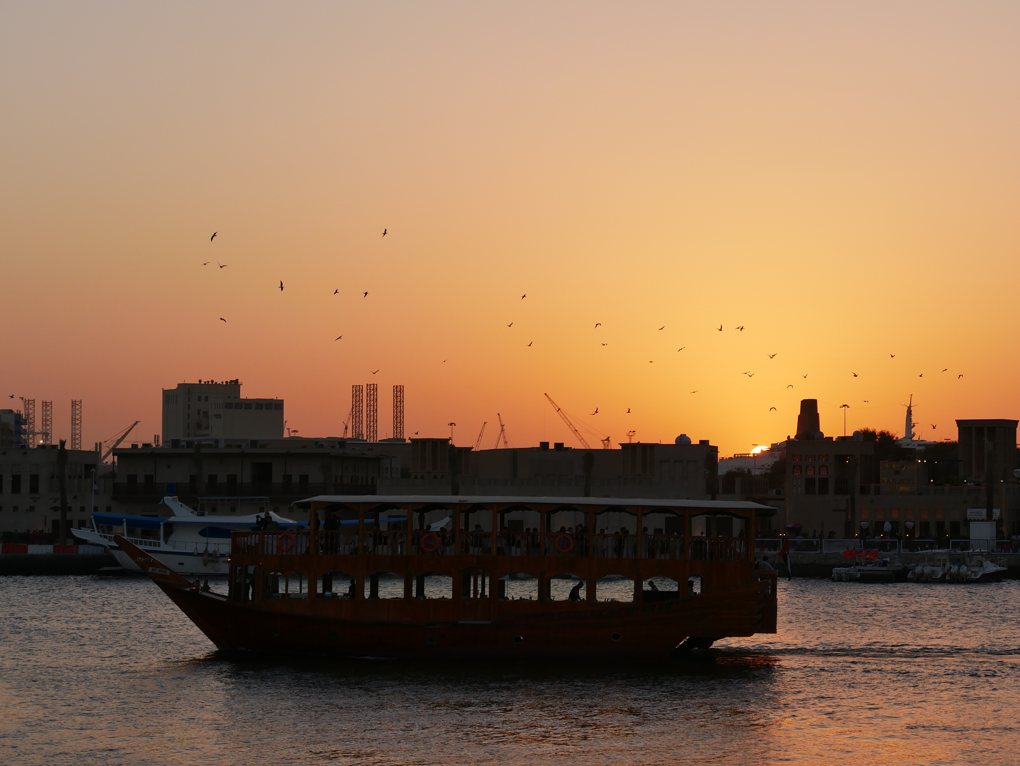 passenger ship in port at sunset near dubai