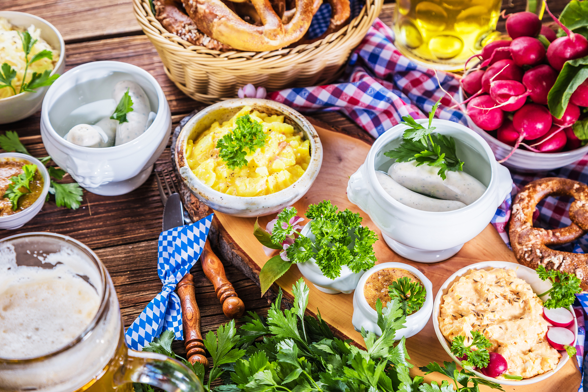 oktoberfest beer, pretzels and various bavarian specialties on w
