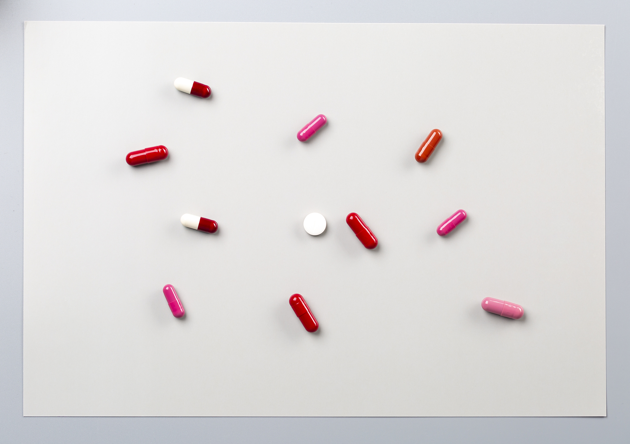 different medications. various pills and capsules. one-color bac