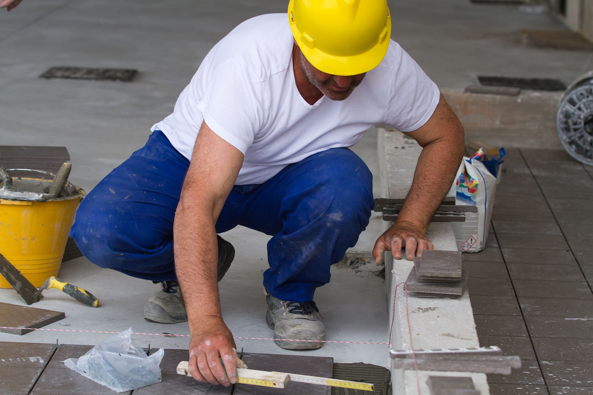 bricklayer at work in building site