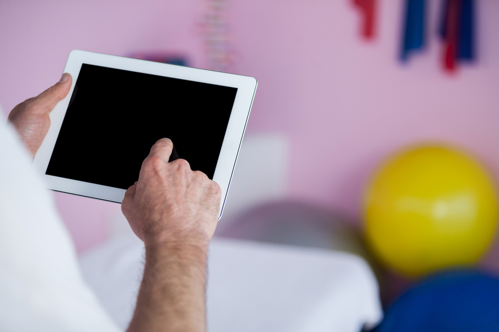 physiotherapist using digital tablet
