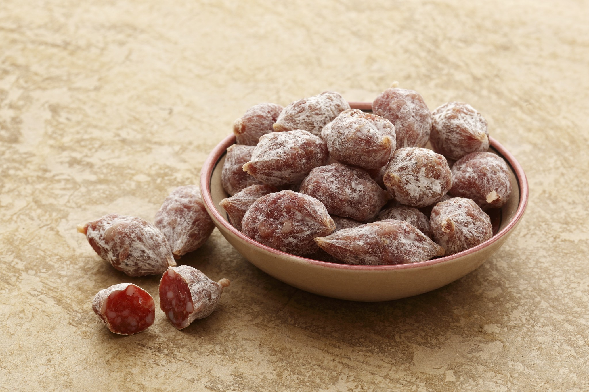 a bowl of salami pralines