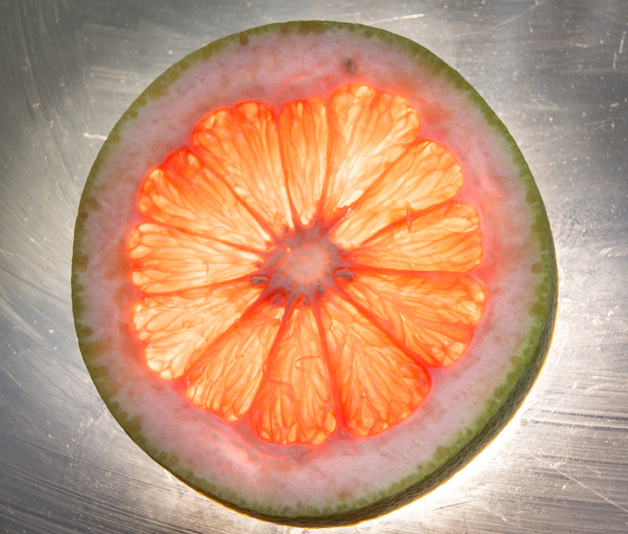 grapefruit slice on lighted glass