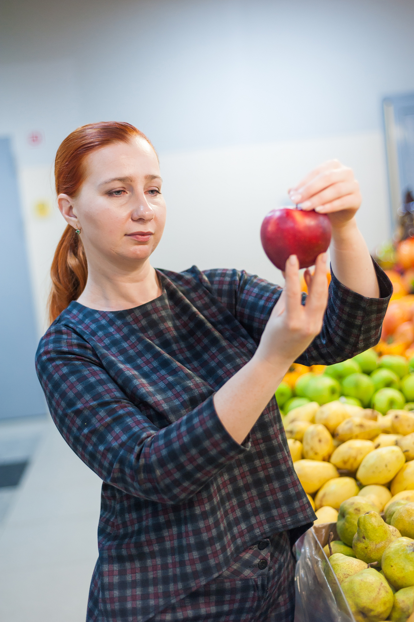 caucasian girl buying fresh vegetables food products at the mark