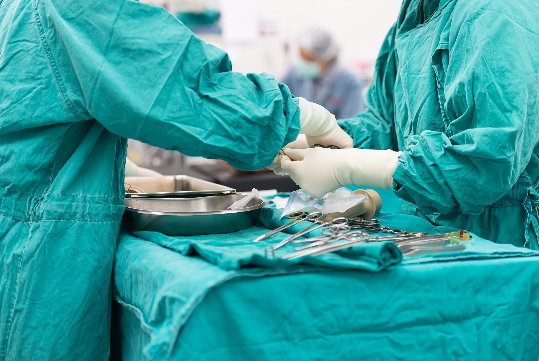 two scrub nurse preparing tools for operation