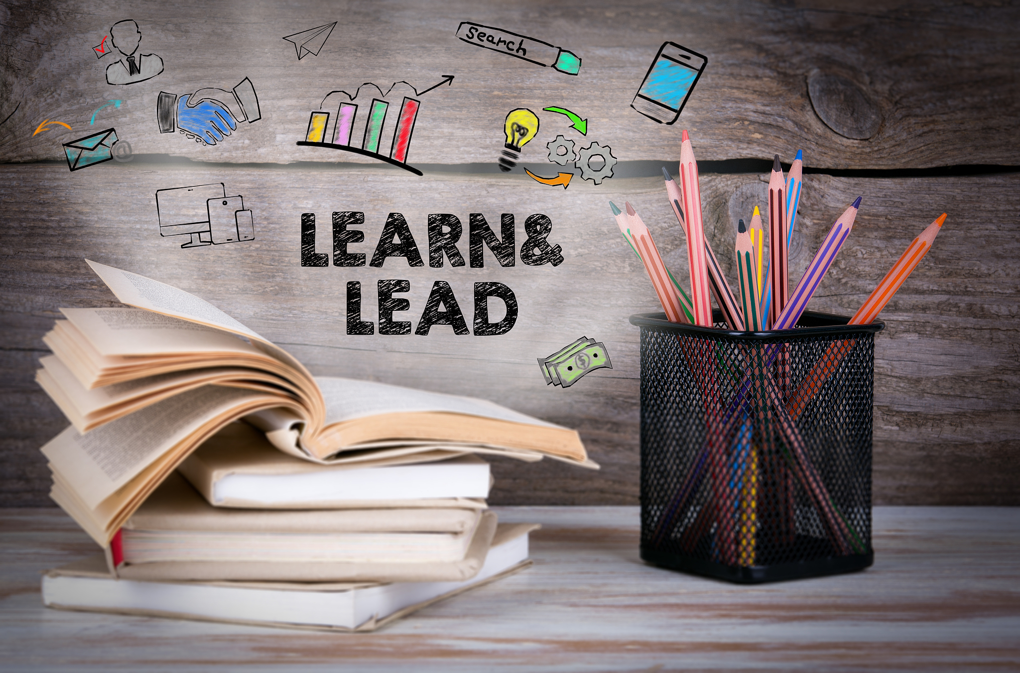 learn and lead. books and pencils on the table