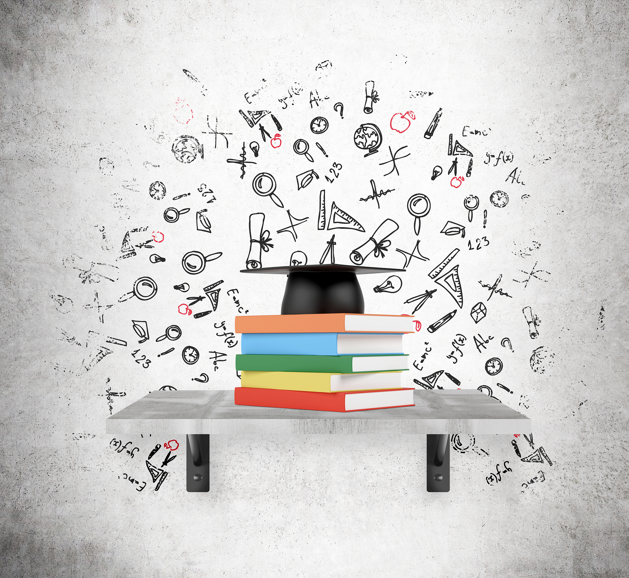 pile of books and academic hat