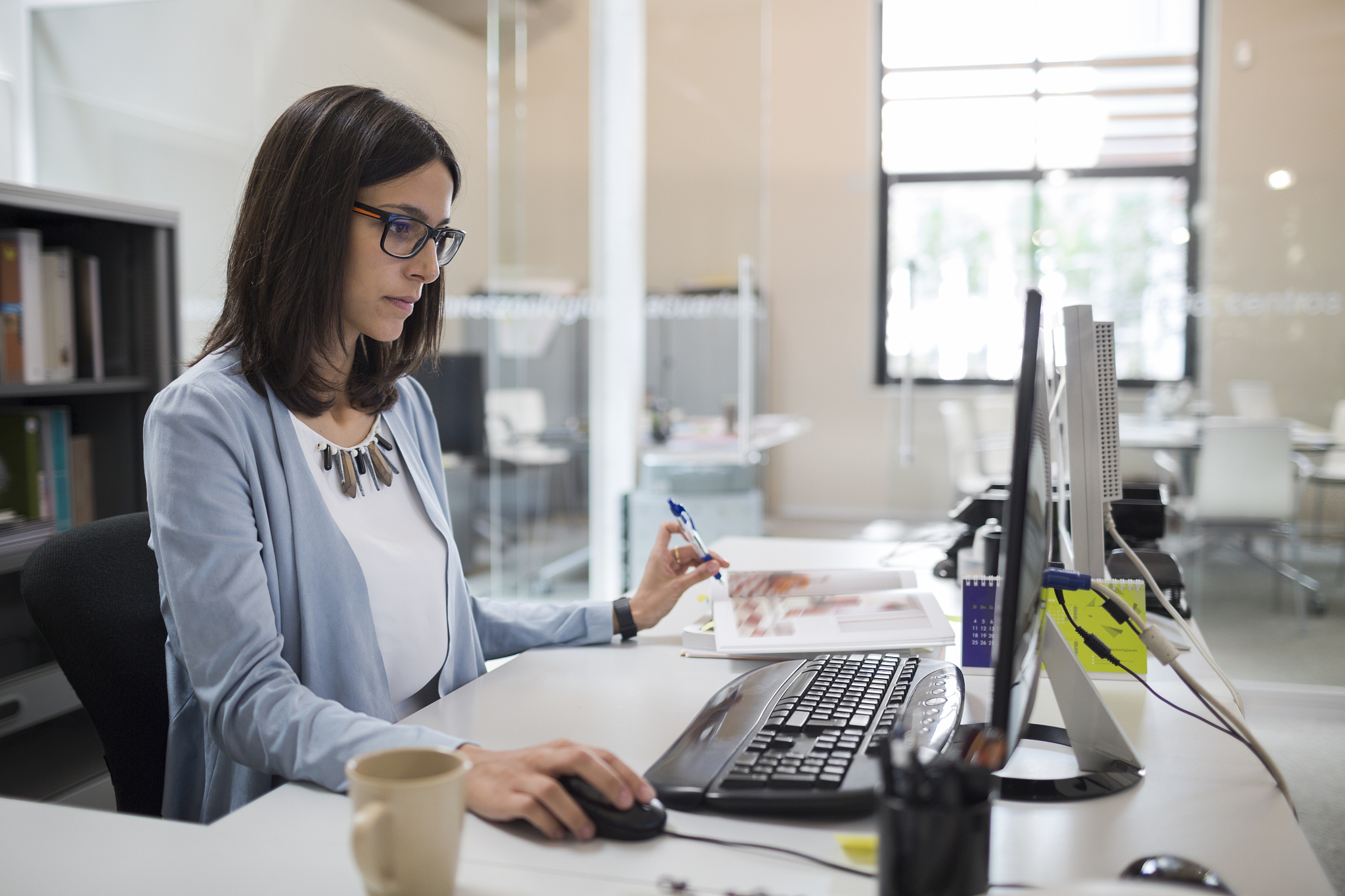 business woman working with computer in an open space office.