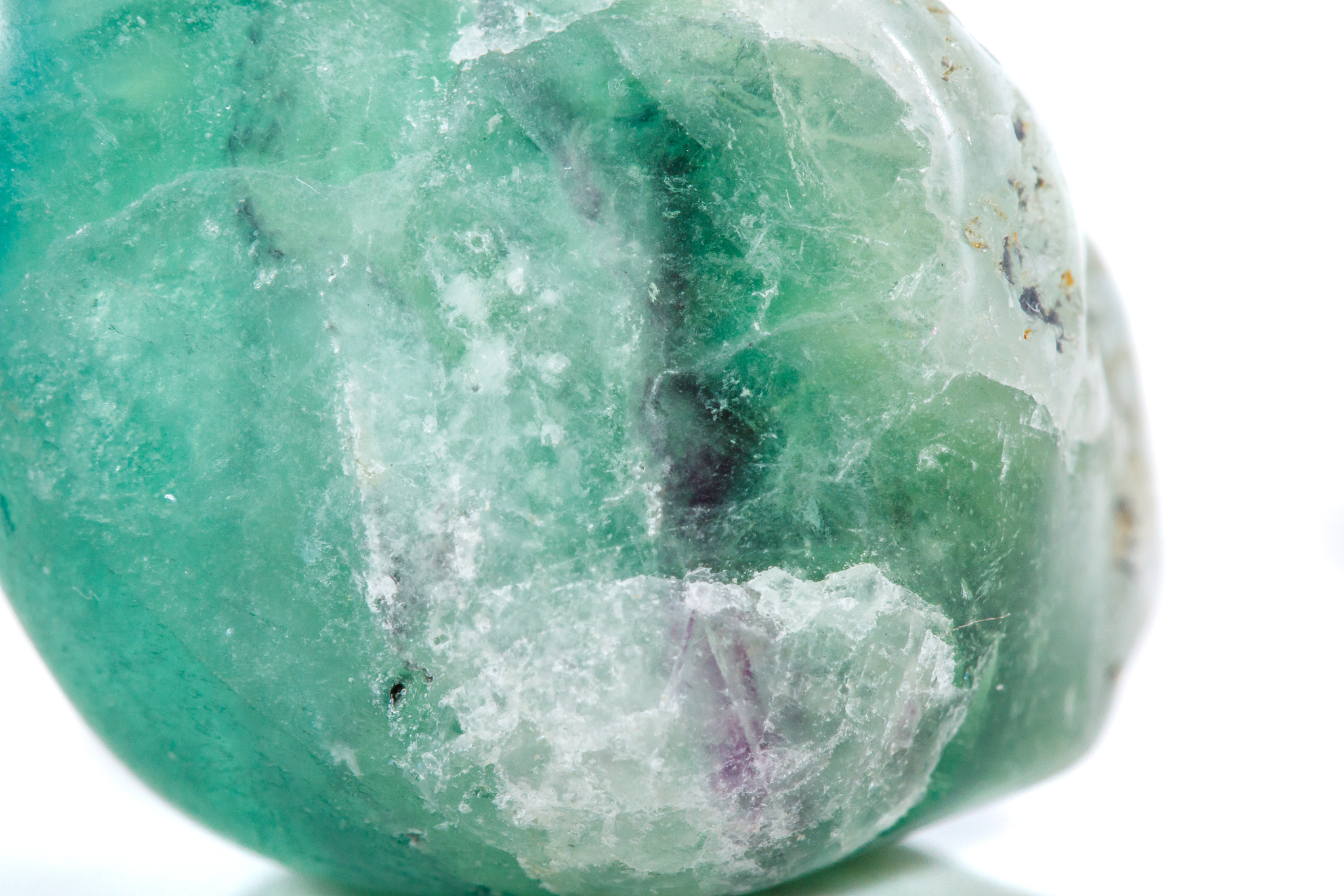 macro mineral stone fluorite crystal on a black background