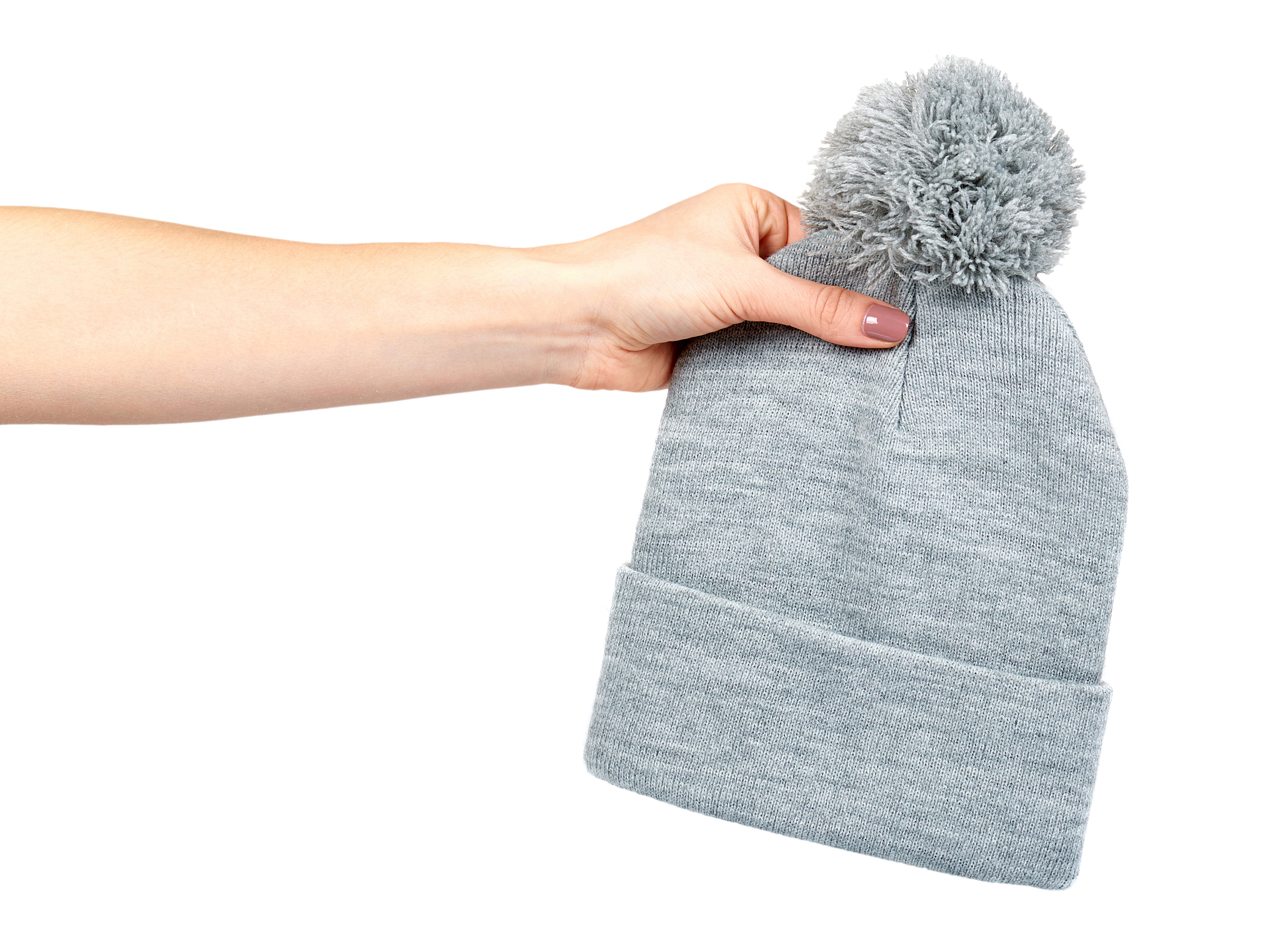 hand with gray knitted hat, warm woolen accessory.