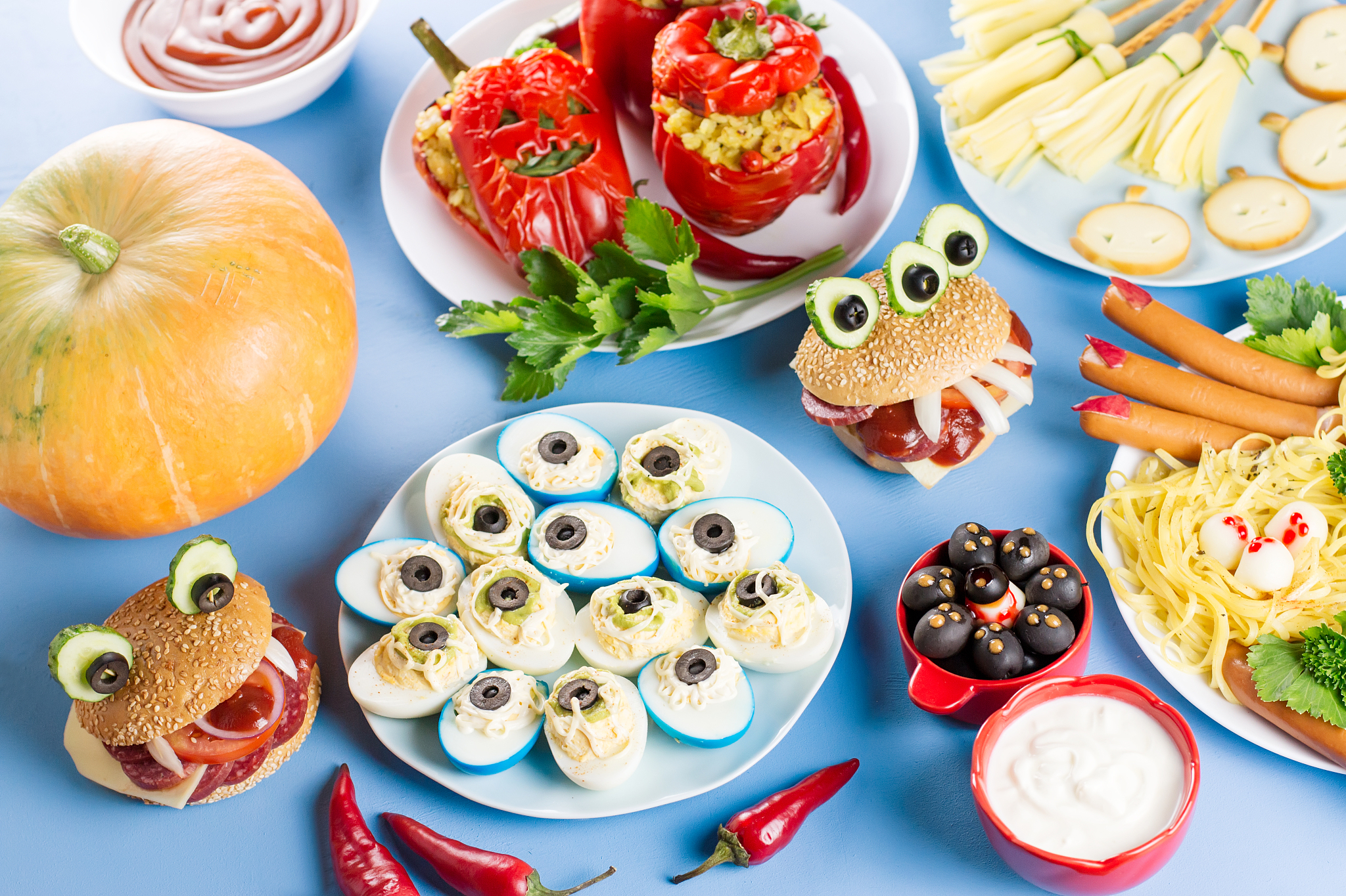 halloween party food. stuffed peppers with scary faces, cheese w