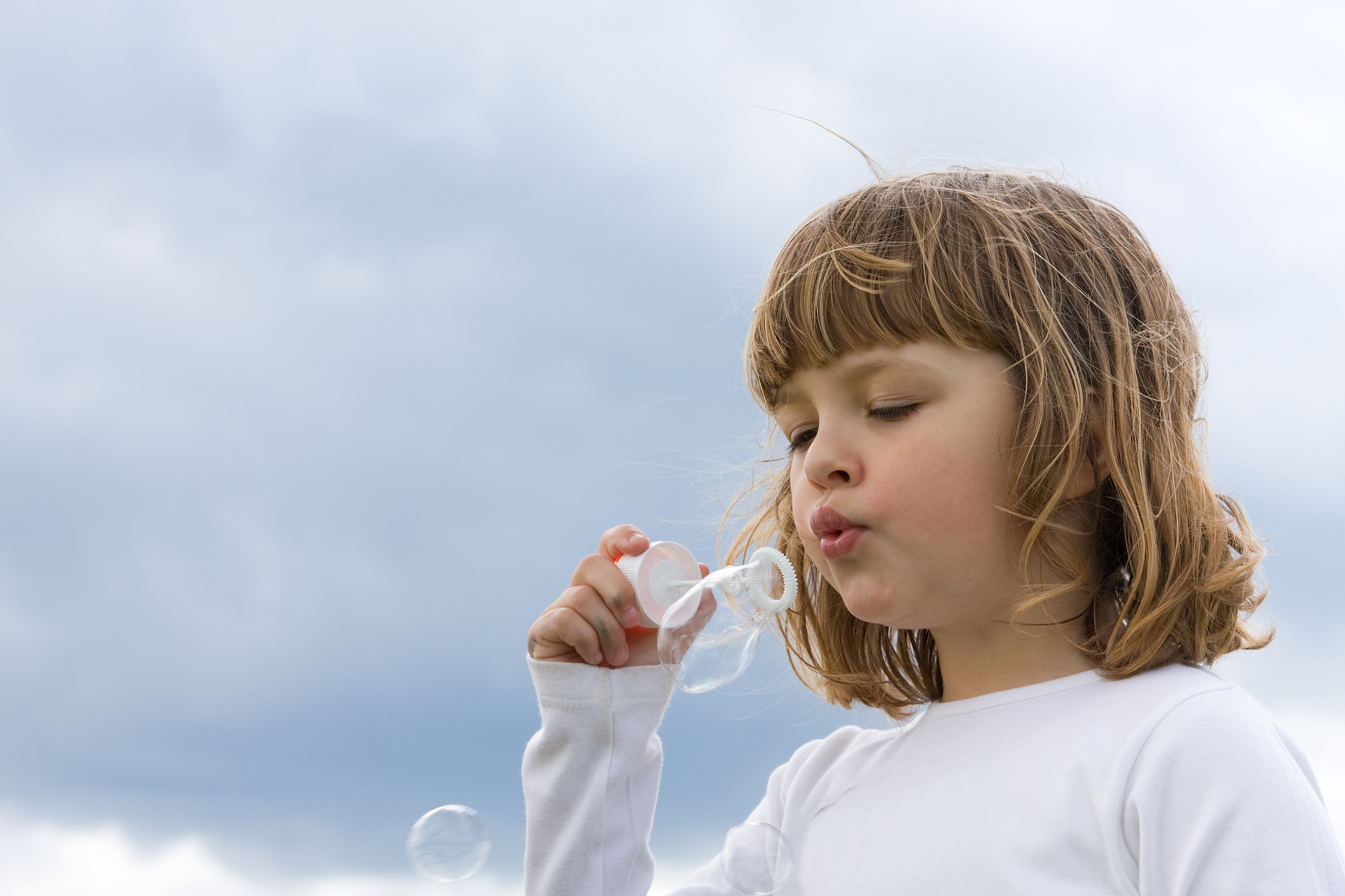 blowing soap bubbles