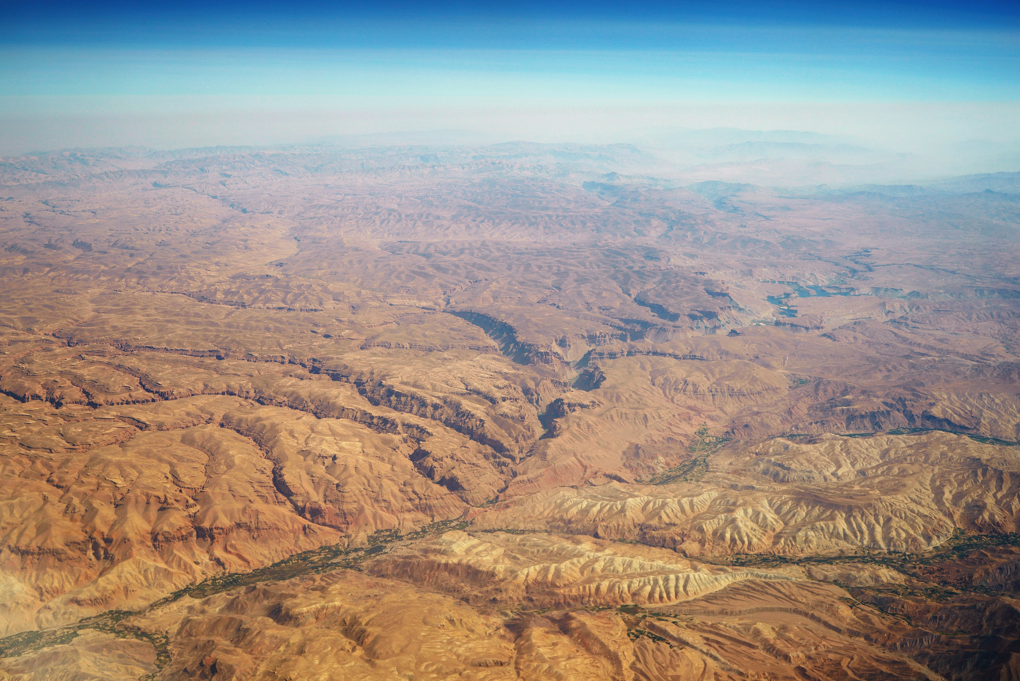 aerial panoramic view at canyons in desert from airplane above p