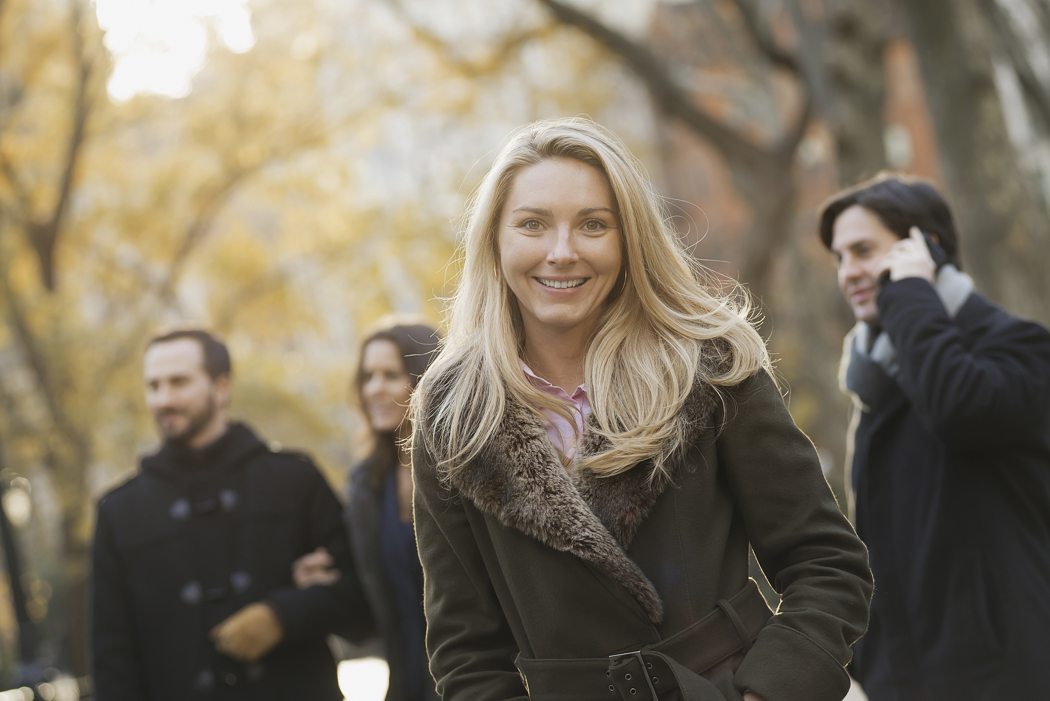 adult group in urban park,woman in front