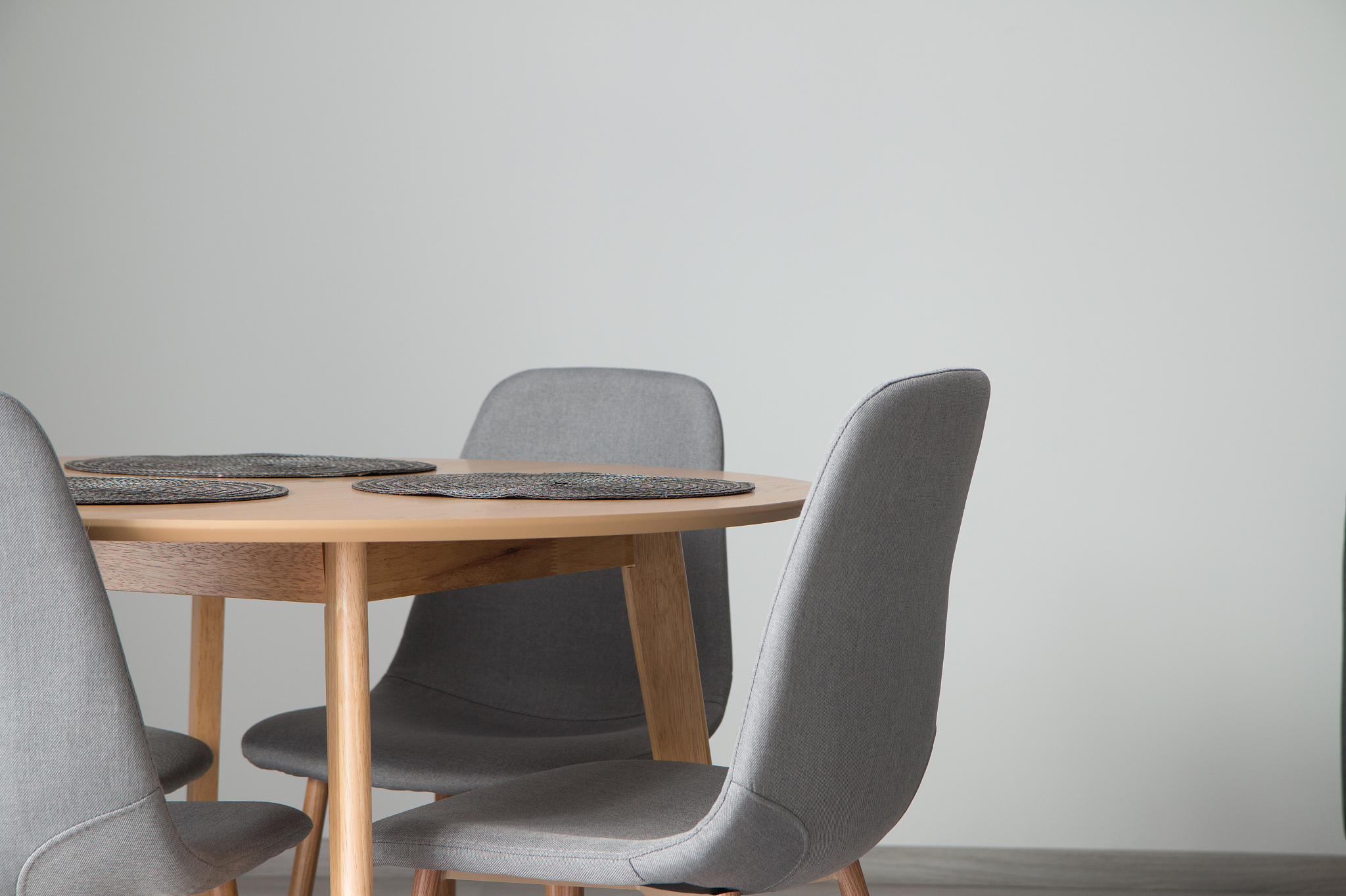 empty chairs and tables against wall