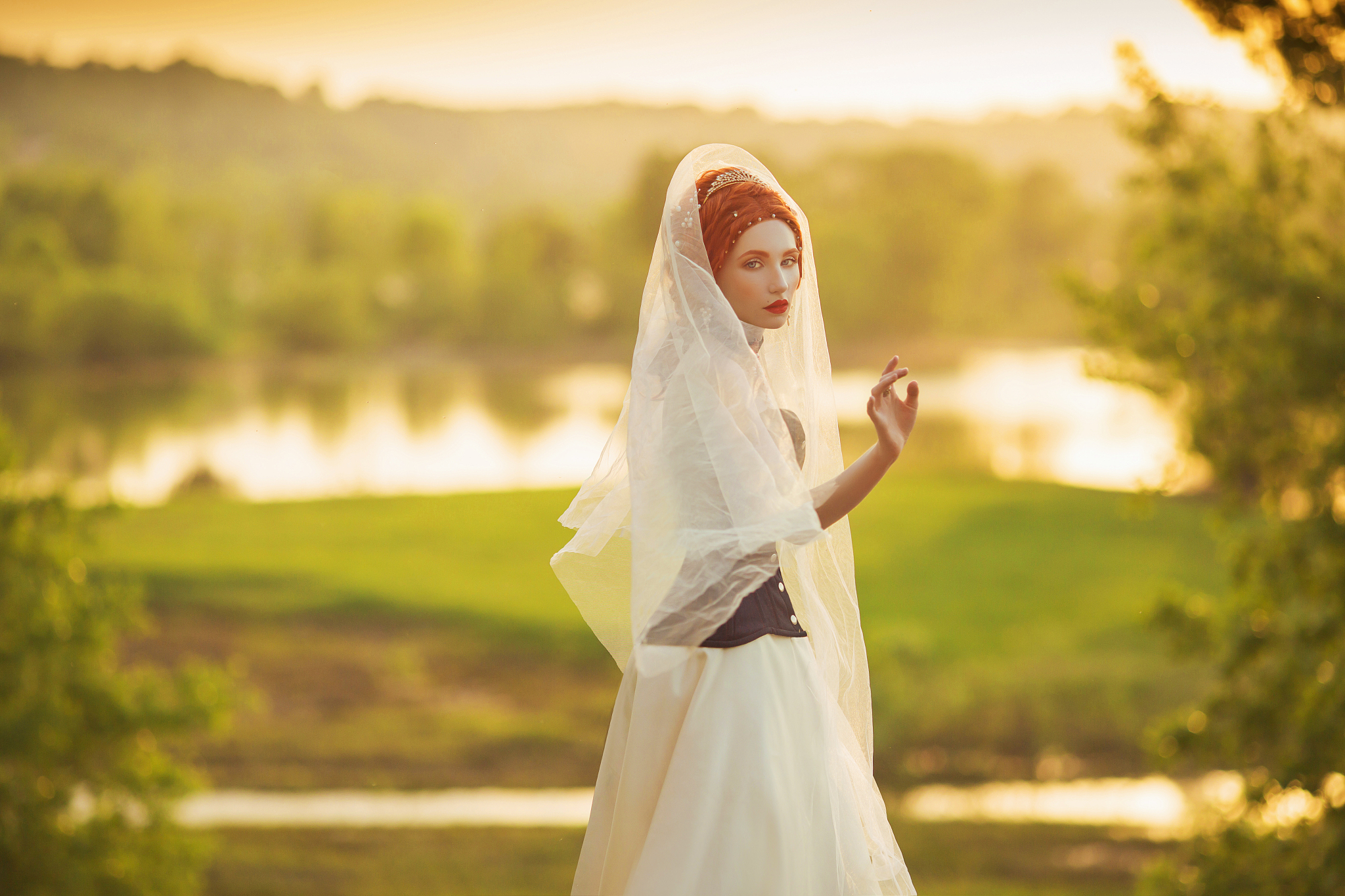 young renaissance princess on veil on nature background. virgin 