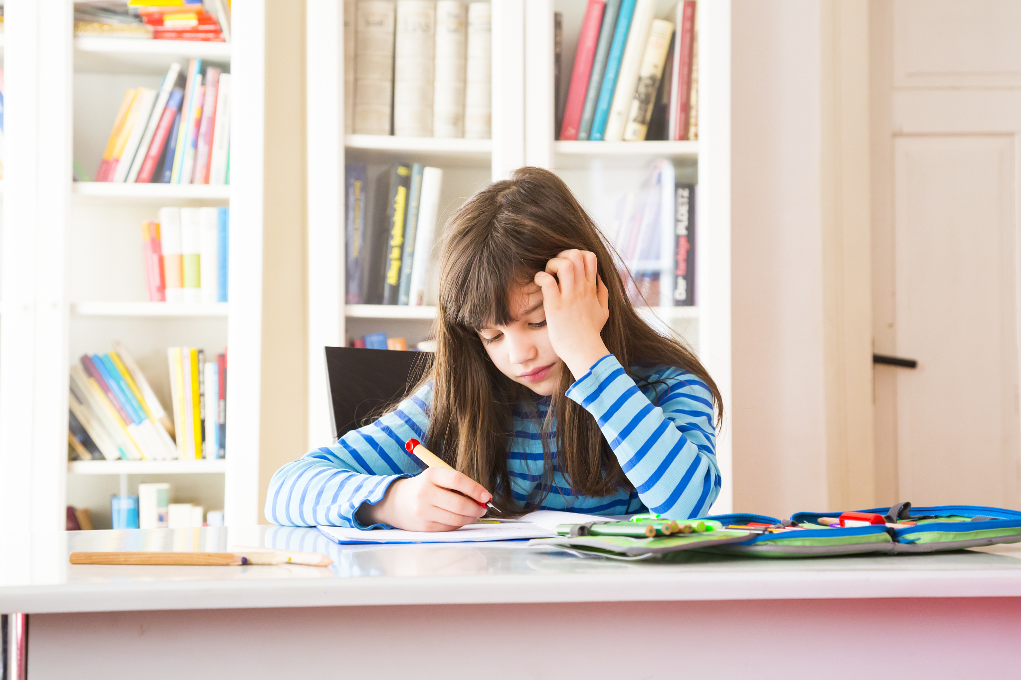 frustrated girl doing homework