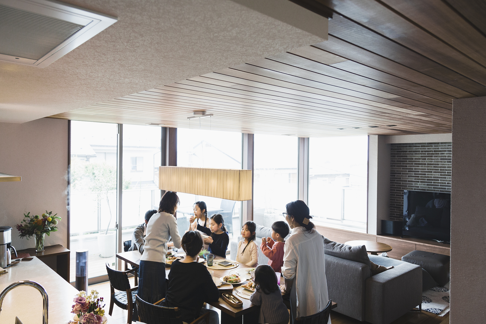 multi family having lunch at home