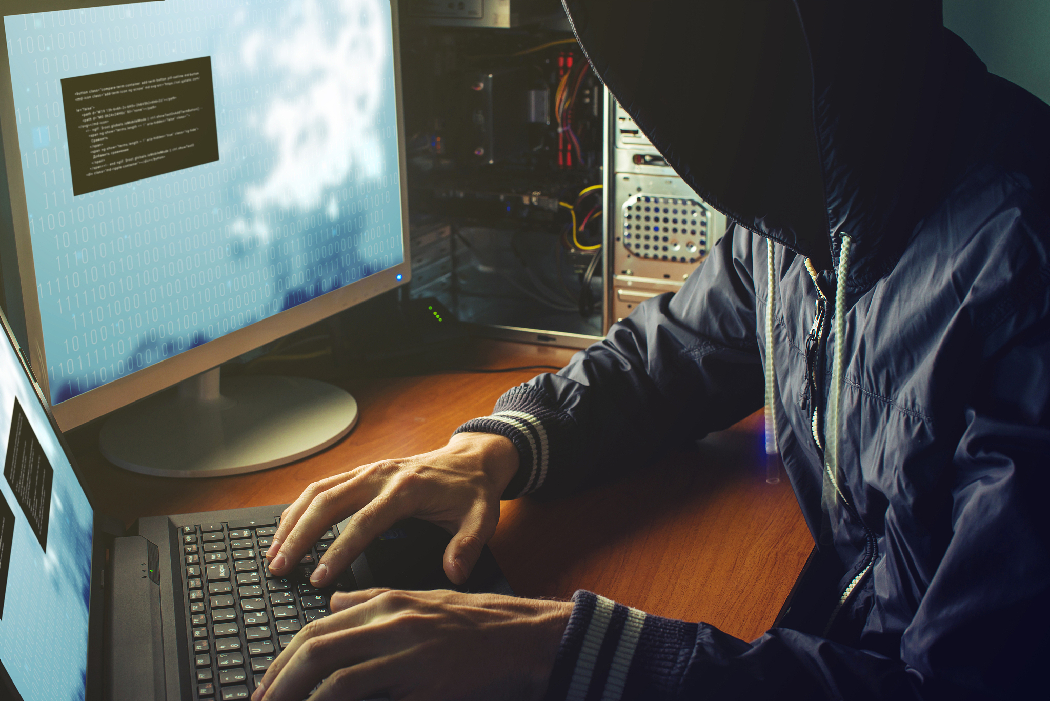 anonymous hacker no face in the darkness, breaks the access