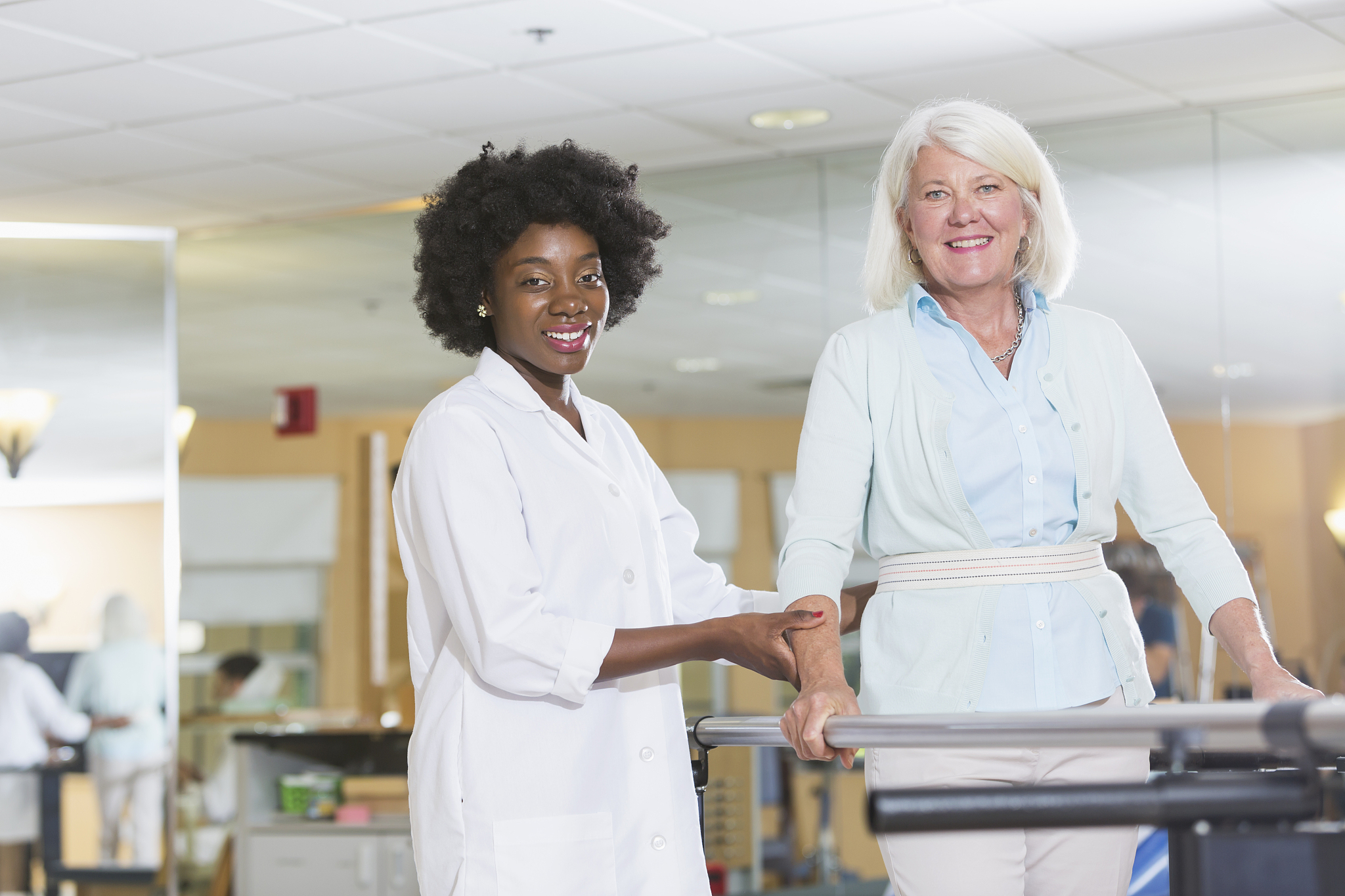 physical therapist working with female patient