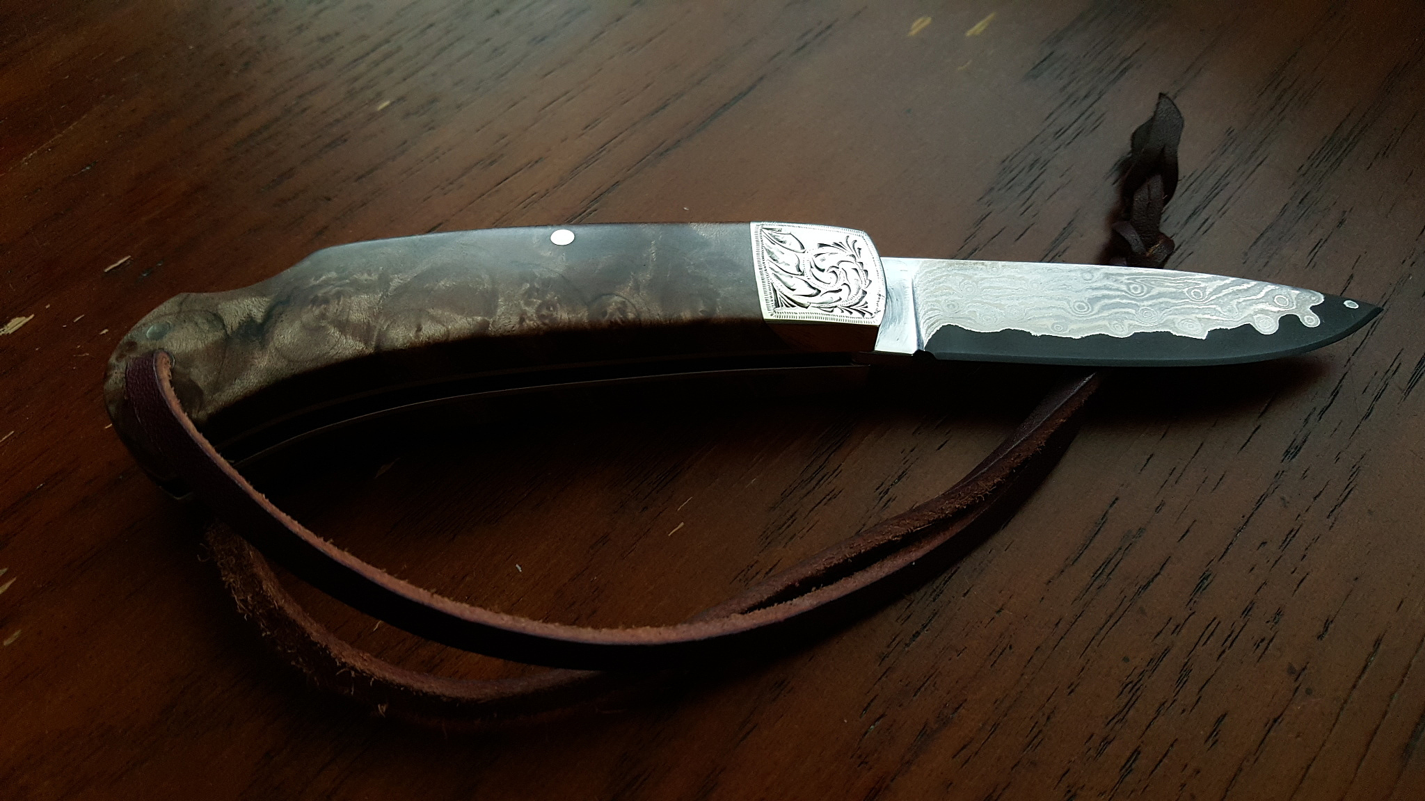 high angle view of kitchen knife on wooden table