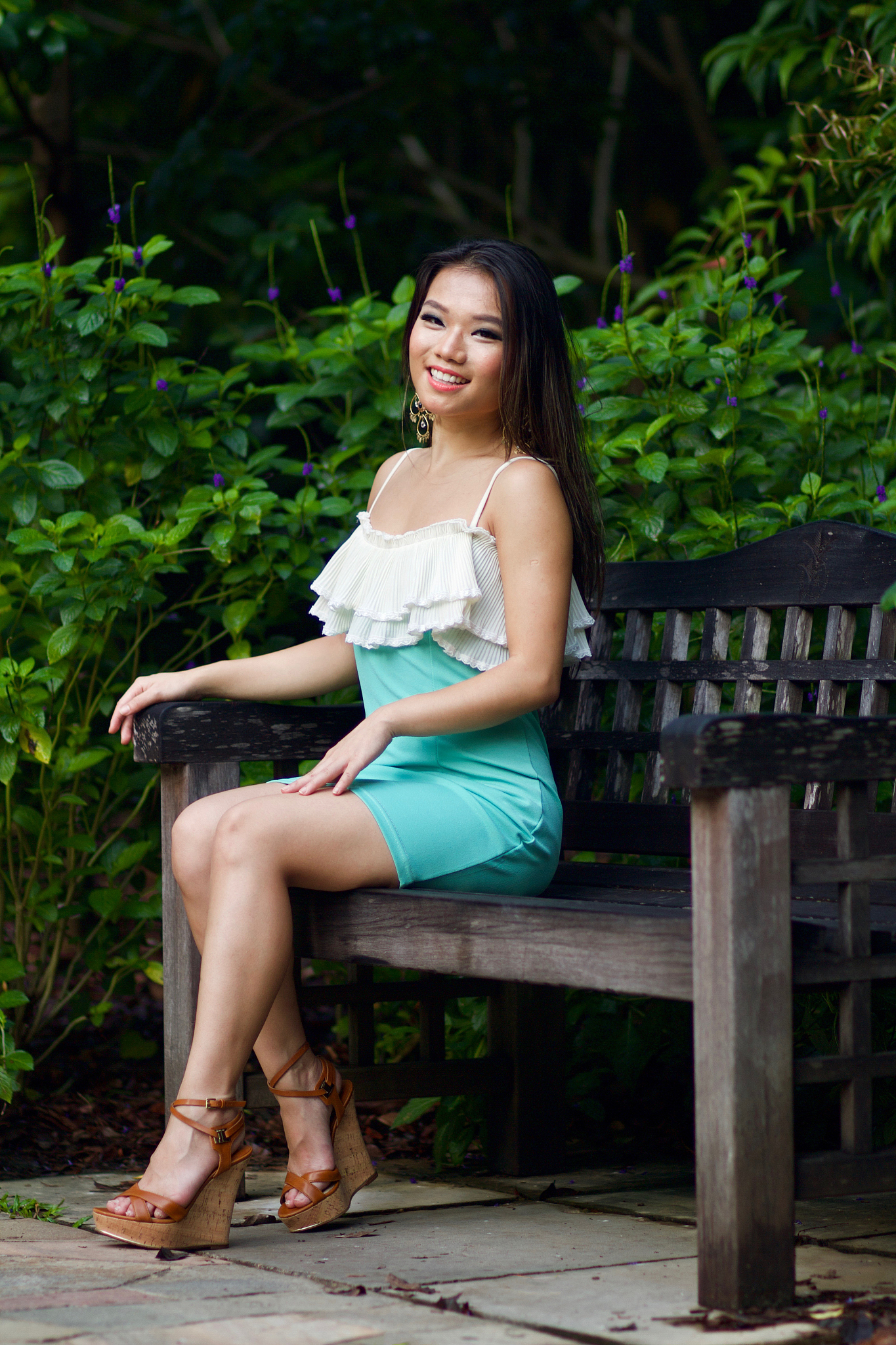 young beautiful asian woman sitting on bench