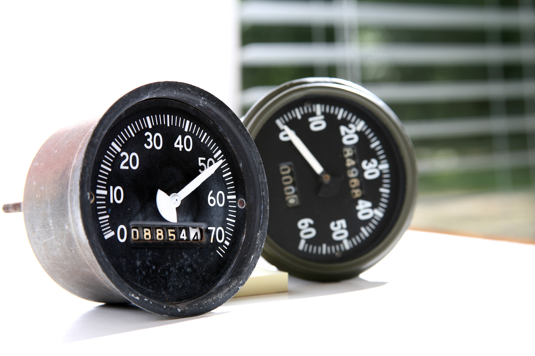 two speedometers