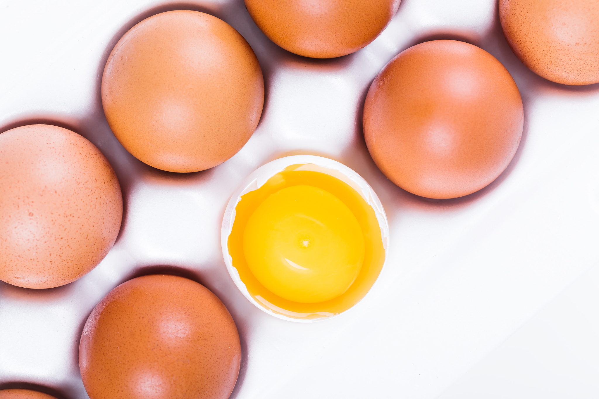 fresh eggs in white box, closeup,