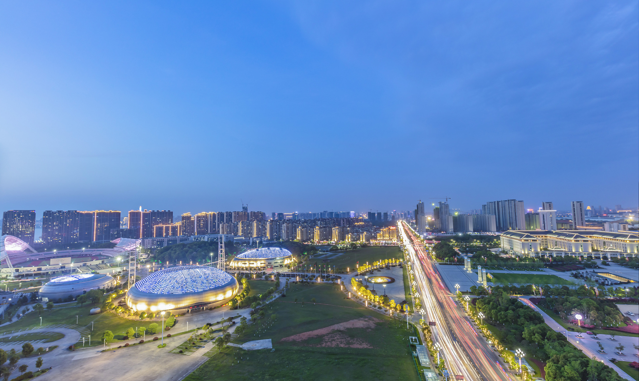 night falls on city buildings and street scenery. jiujiang city,