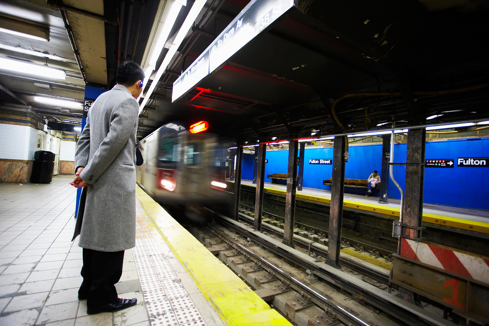 man waiting for subway