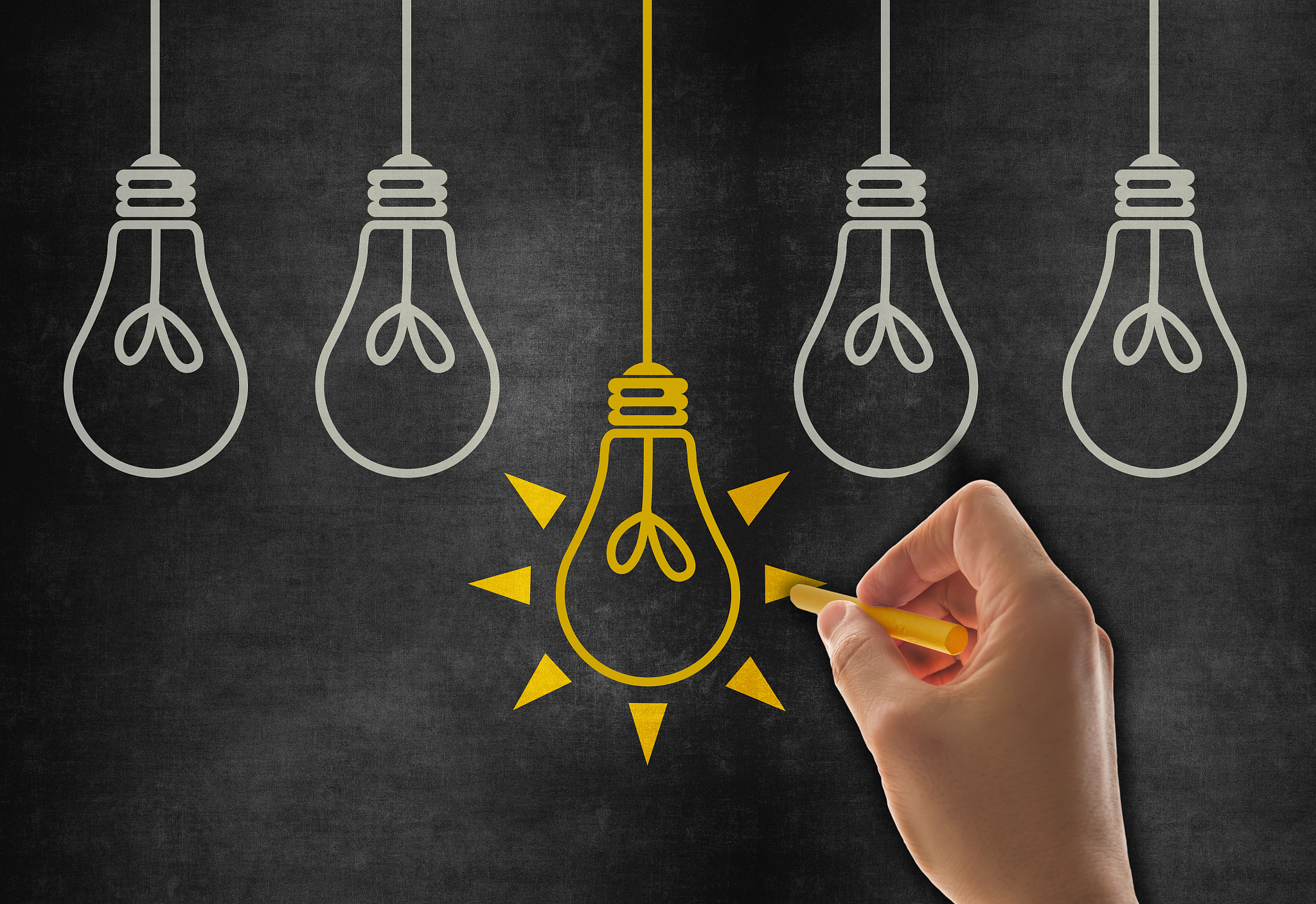 hand drawing big idea light bulb on blackboard