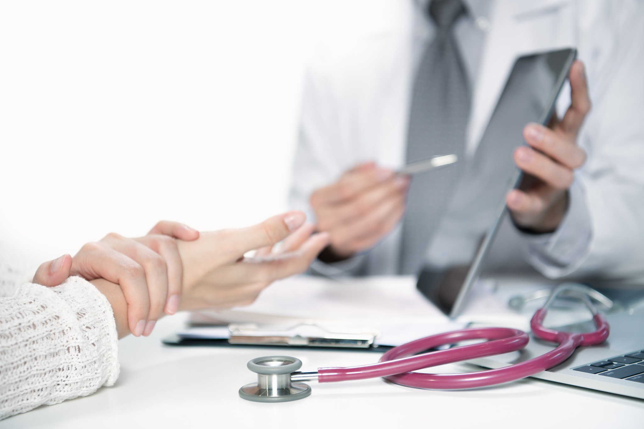 medical doctor and patient discussing and consulting in hospital