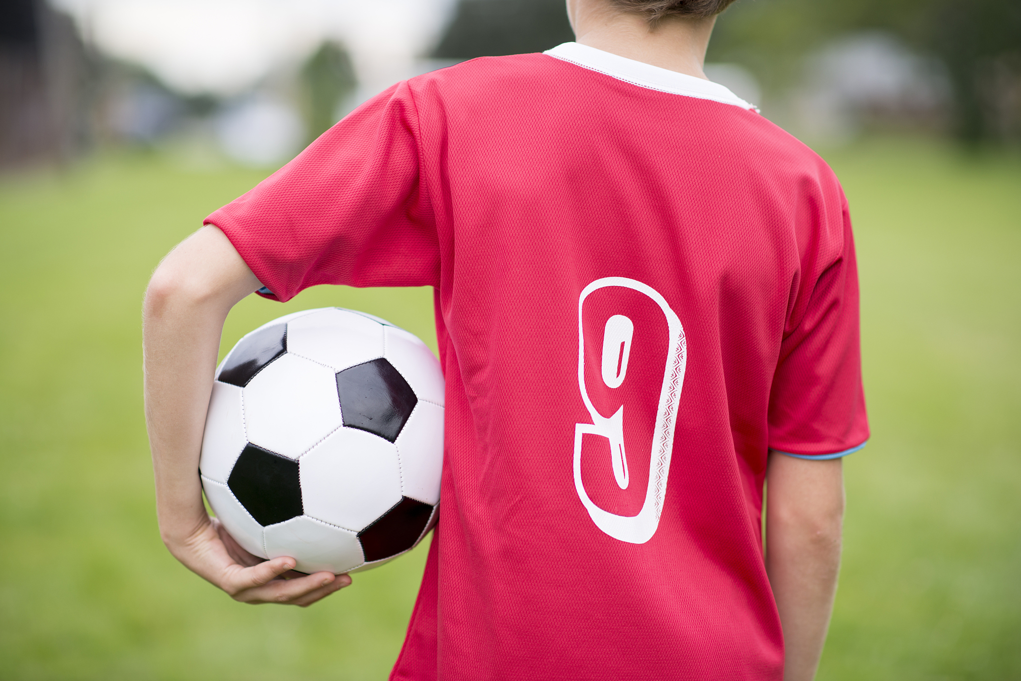 holding soccer ball