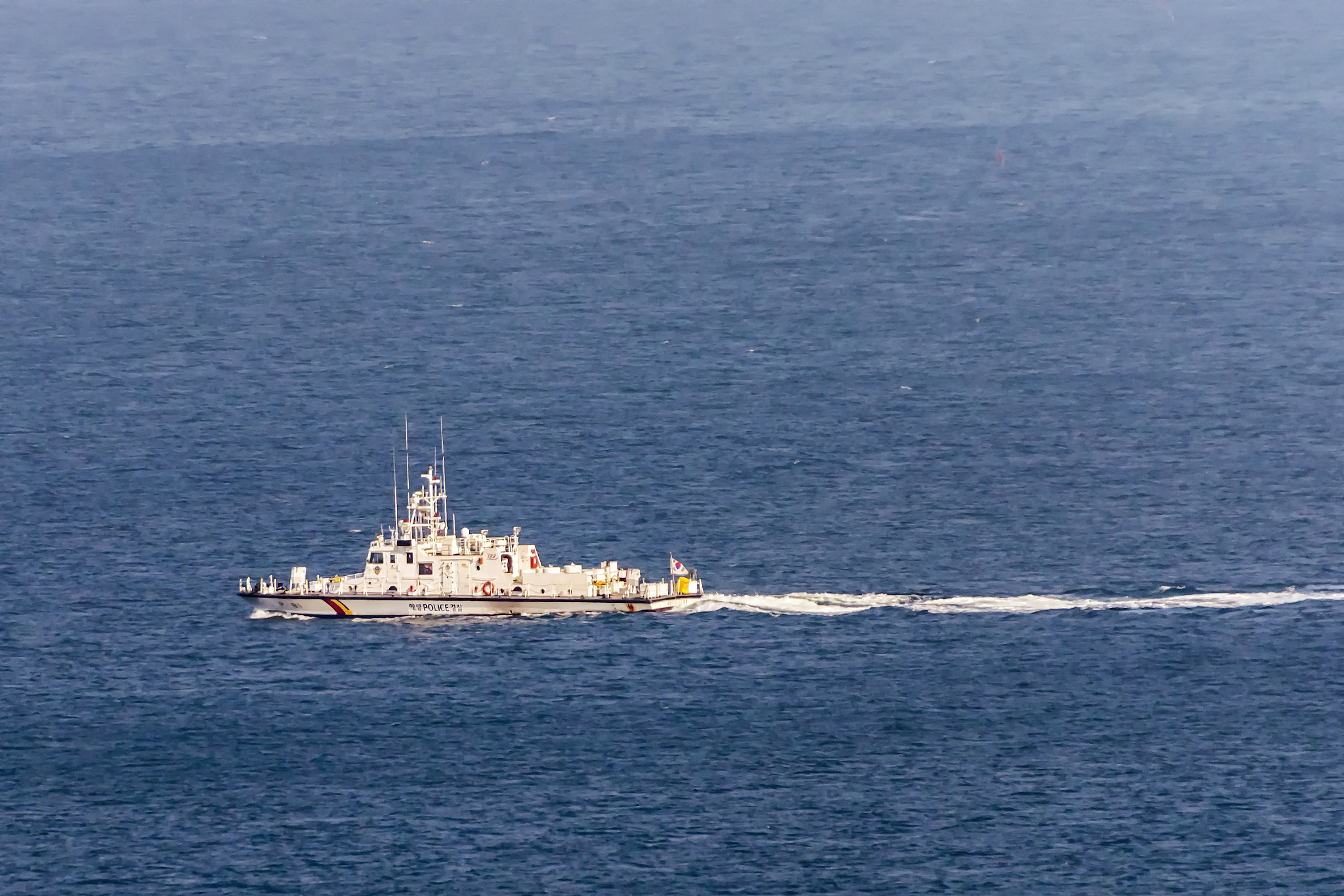 a military boat on the blue sea
