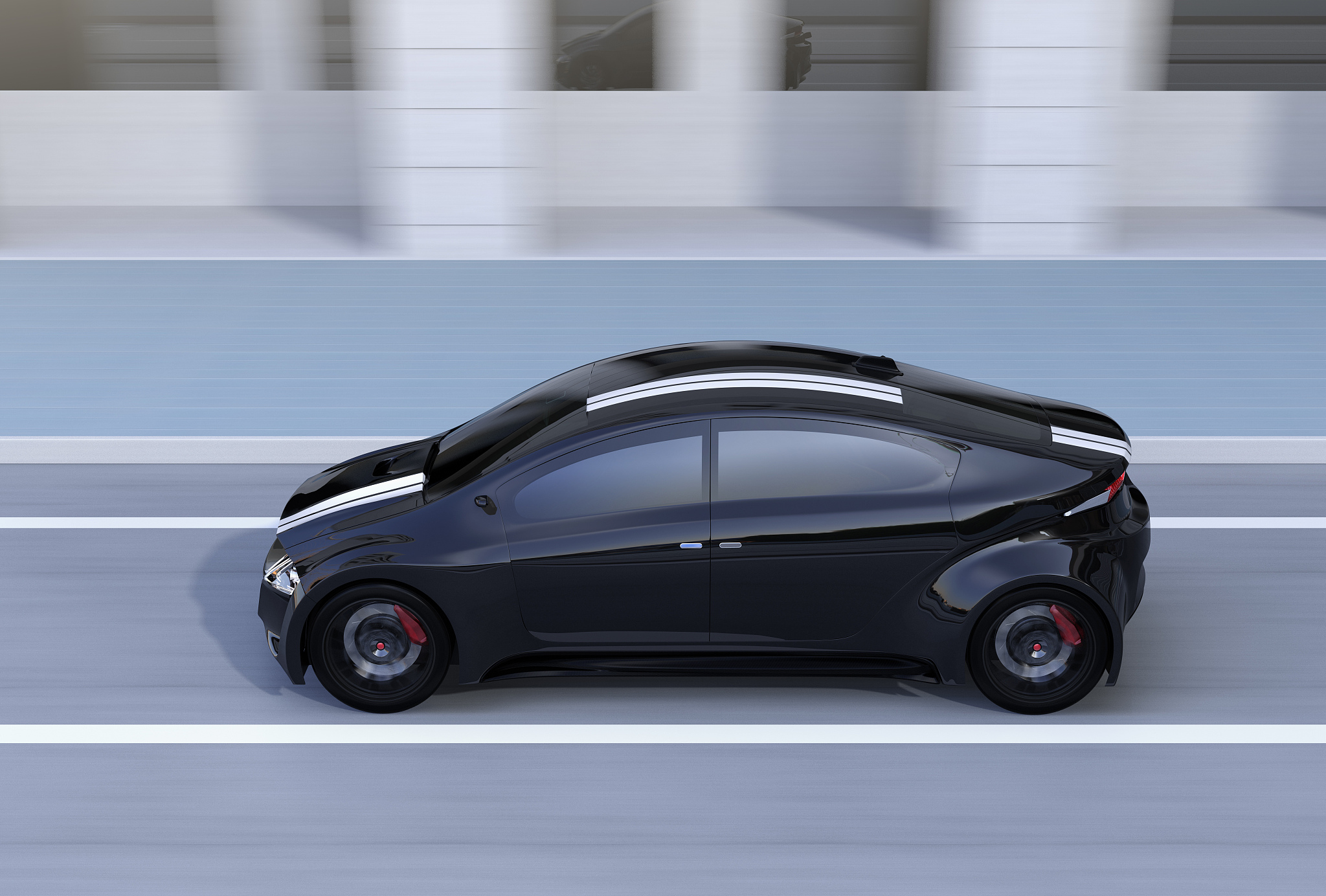 side view of black sports car driving on the street